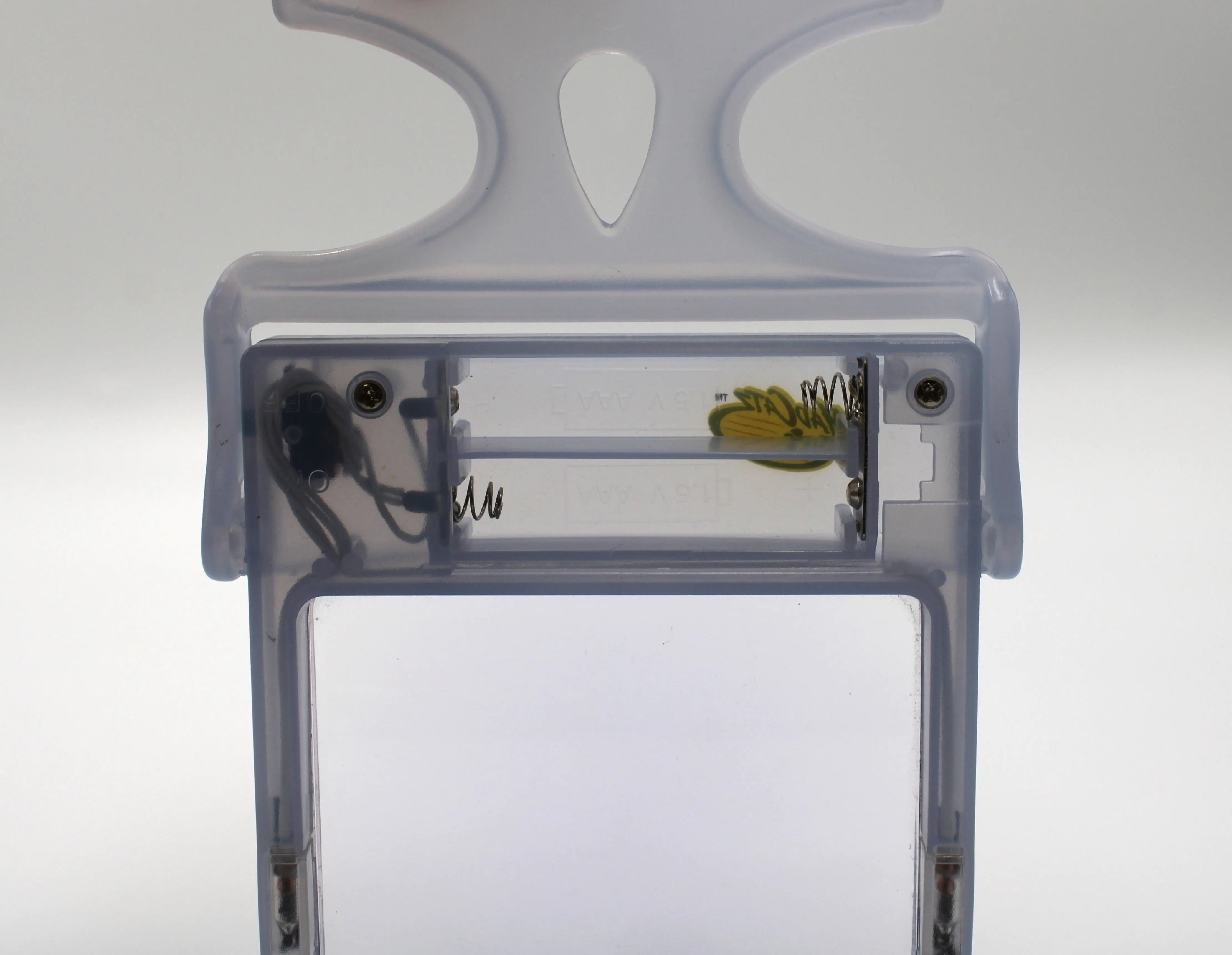 Pre-owned Glacier Ice Nintendo Game Boy Advance (GBA) Mad Catz Light & Screen Magnifier. Picture of clean battery compartment.