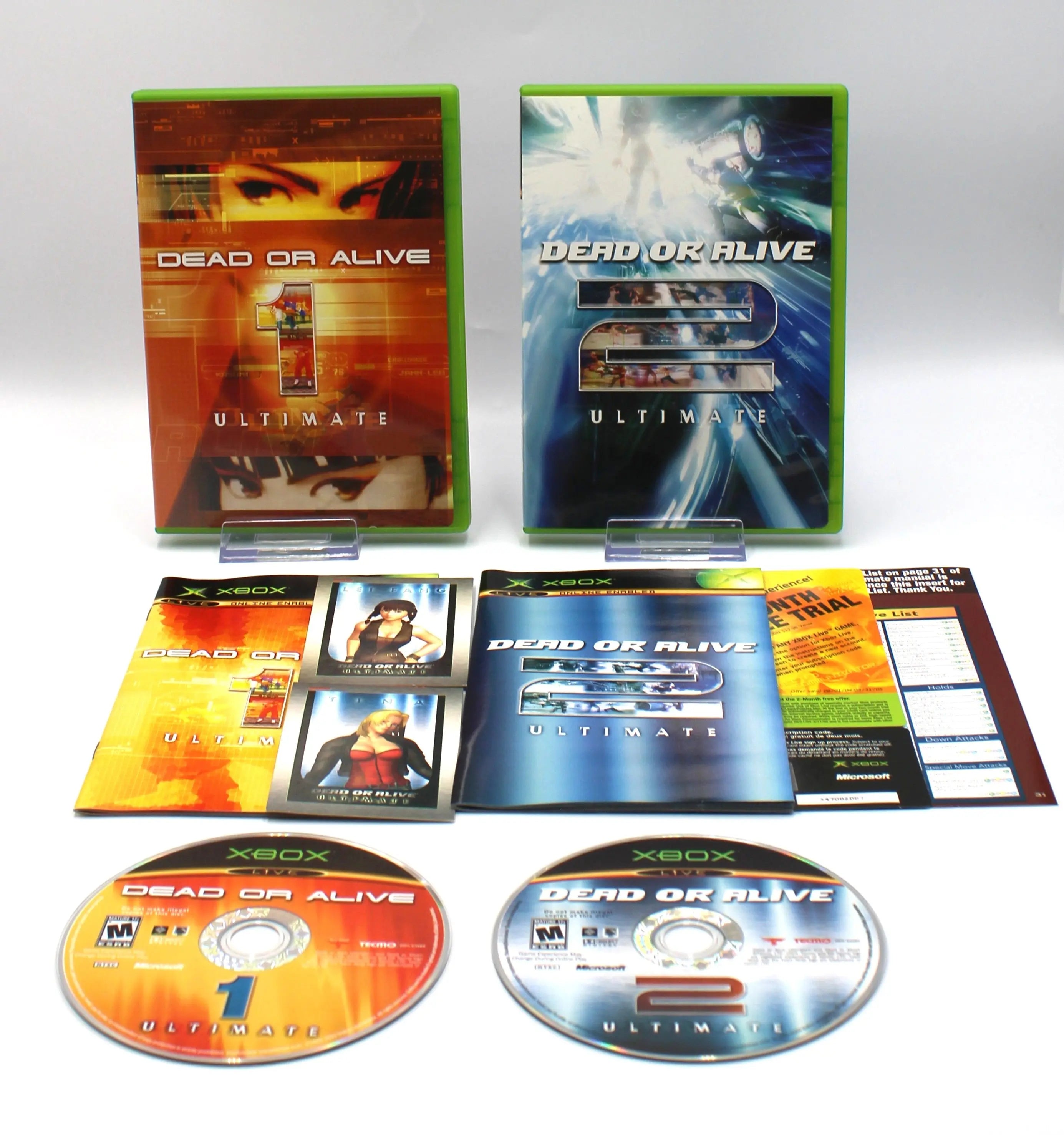 Front view of both game cases for Dead or Alive Ultimate for Microsoft Xbox Original NTSC-U, showing case artwork and inserted materials including manuals, cards, and both game discs 1 and 2.