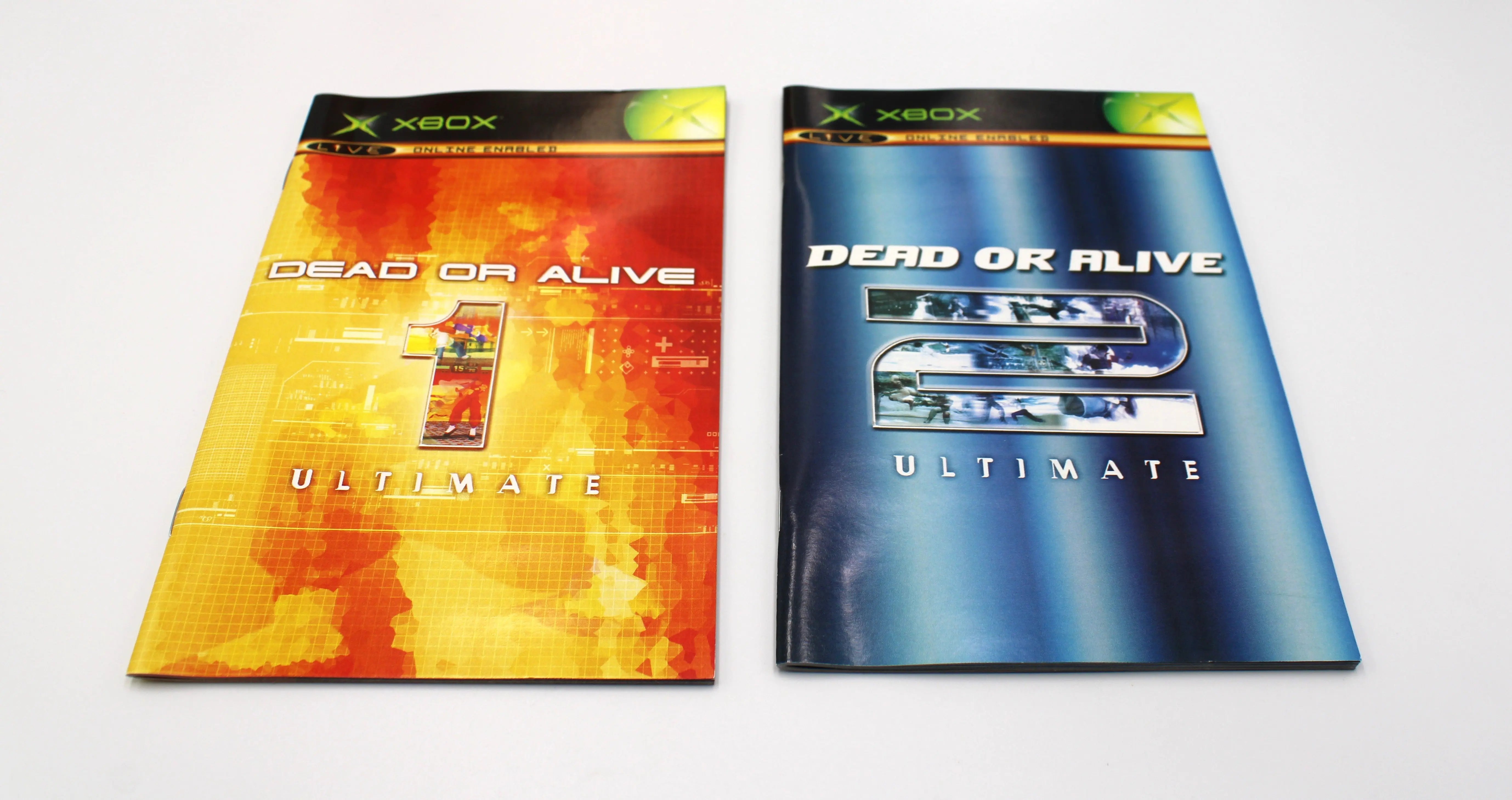 Front view of both game inserts for Dead or Alive Ultimate for Microsoft Xbox Original NTSC-U, showing cover artwork and condition of manuals.