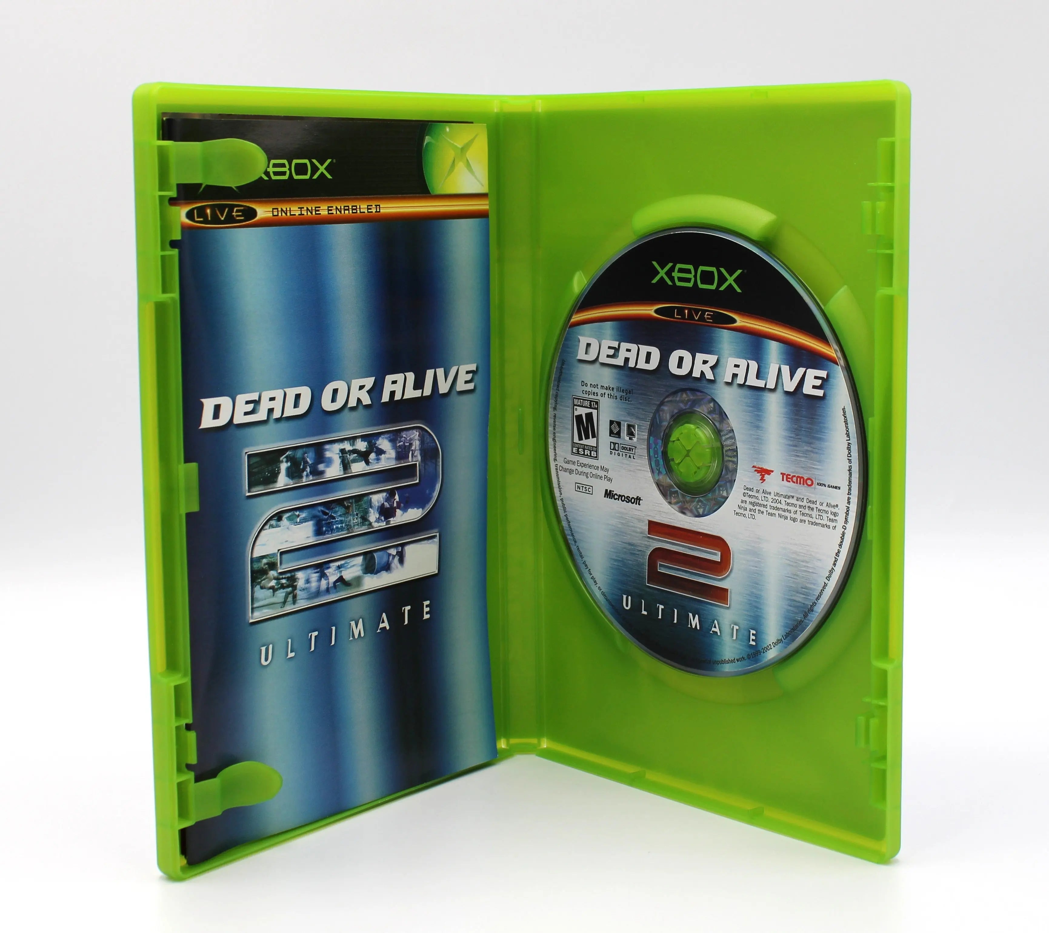 Open case view of Dead or Alive 2 for Microsoft Xbox Original NTSC-U, showing manual placement and game disc secured in tray.