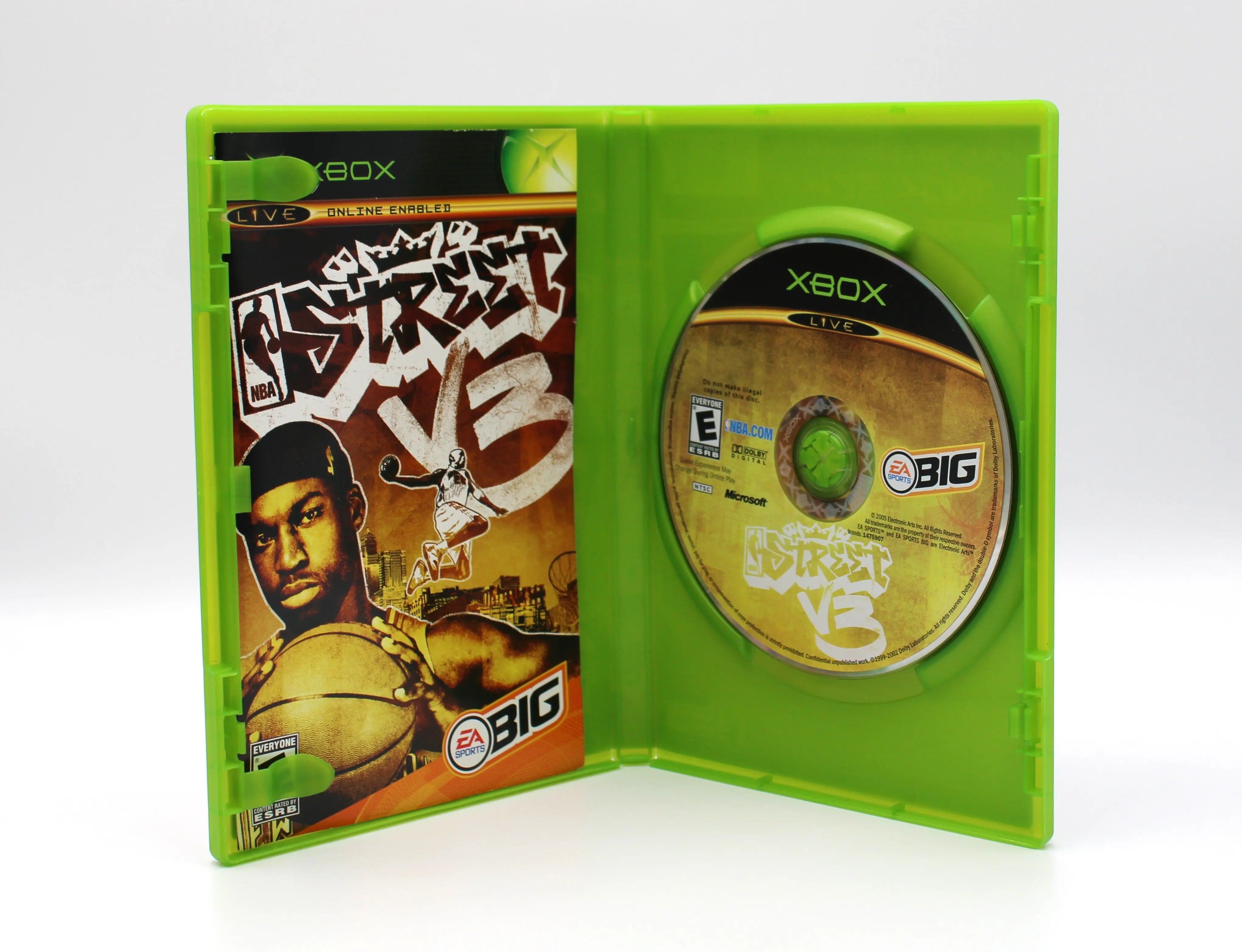 Open case view of NBA Street Vol. 3 for Microsoft Xbox Original NTSC-U, showing manual placement and game disc secured in tray.