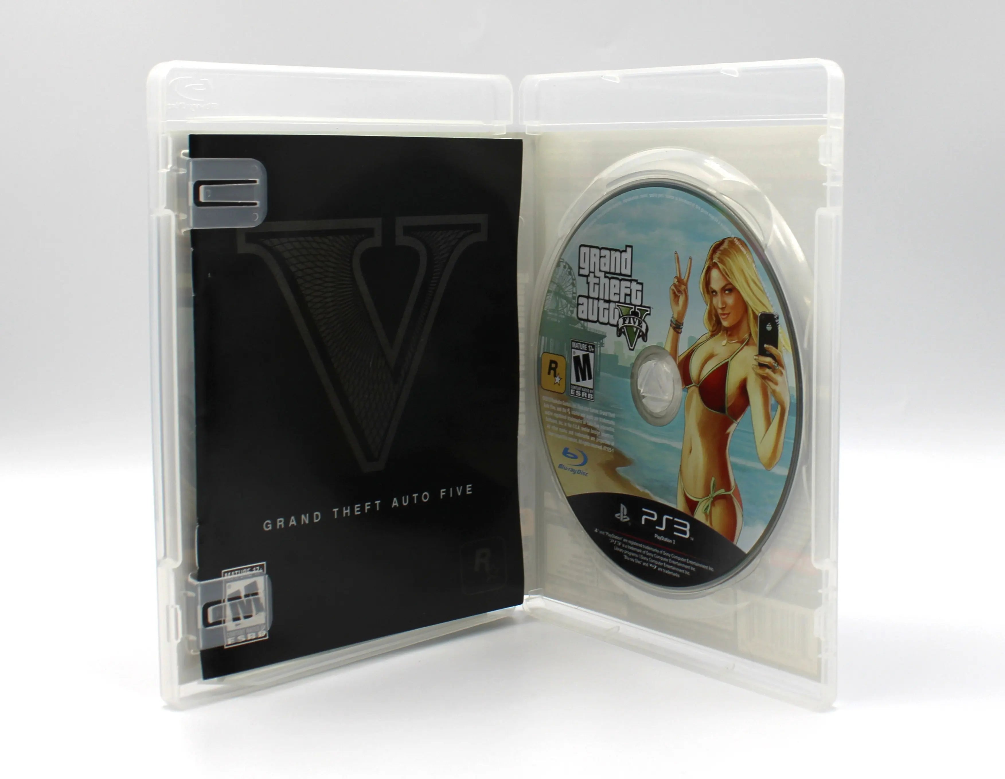 Opened case view of Grand Theft Auto V (GTA 5) for PS3 (2013) NTSC-U, showing disc, manual, and full unfolded map insert