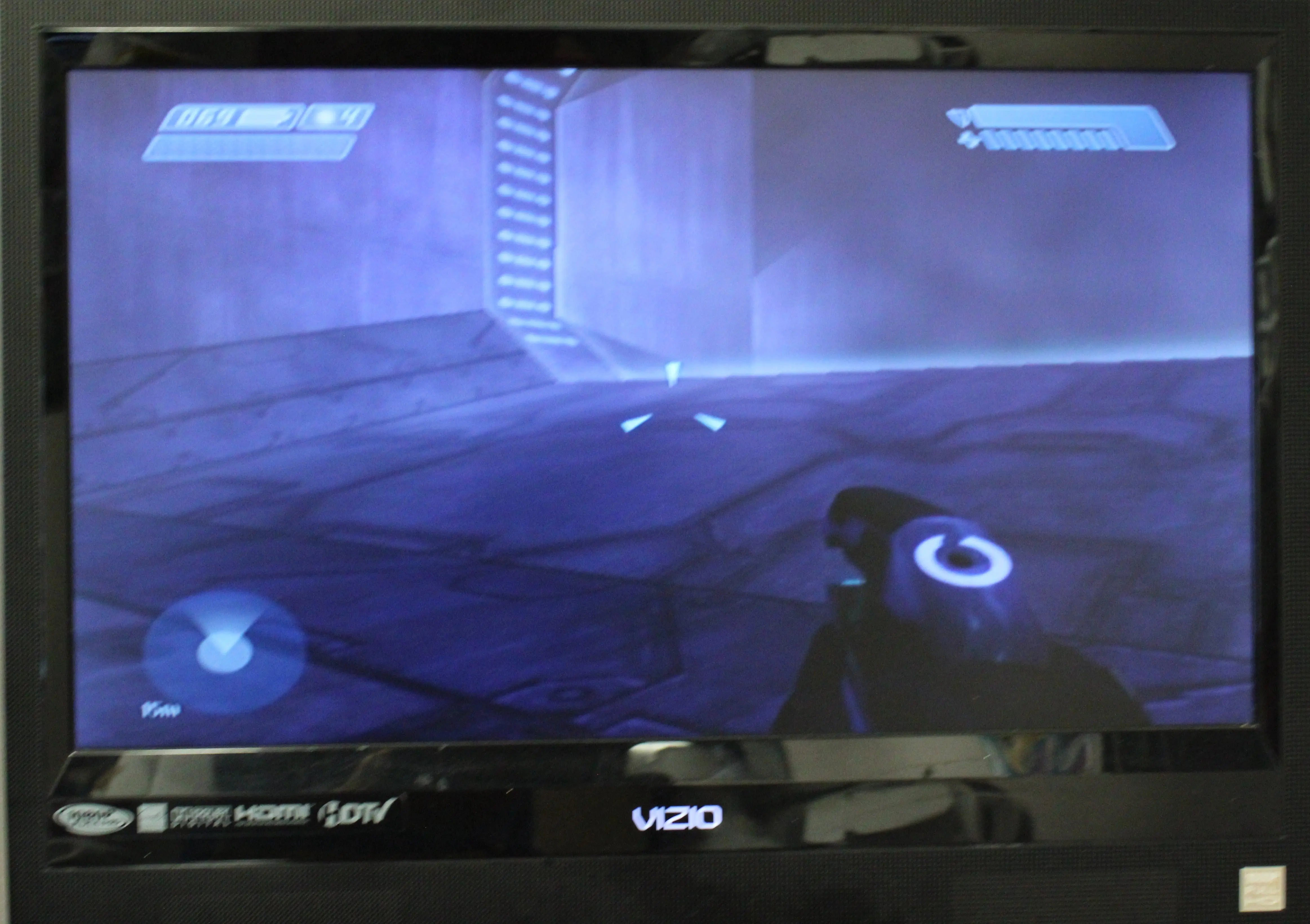Gameplay screenshot of Halo: Combat Evolved for Microsoft Xbox Original NTSC-U, showing in-game sci-fi shooter action and visual style.
