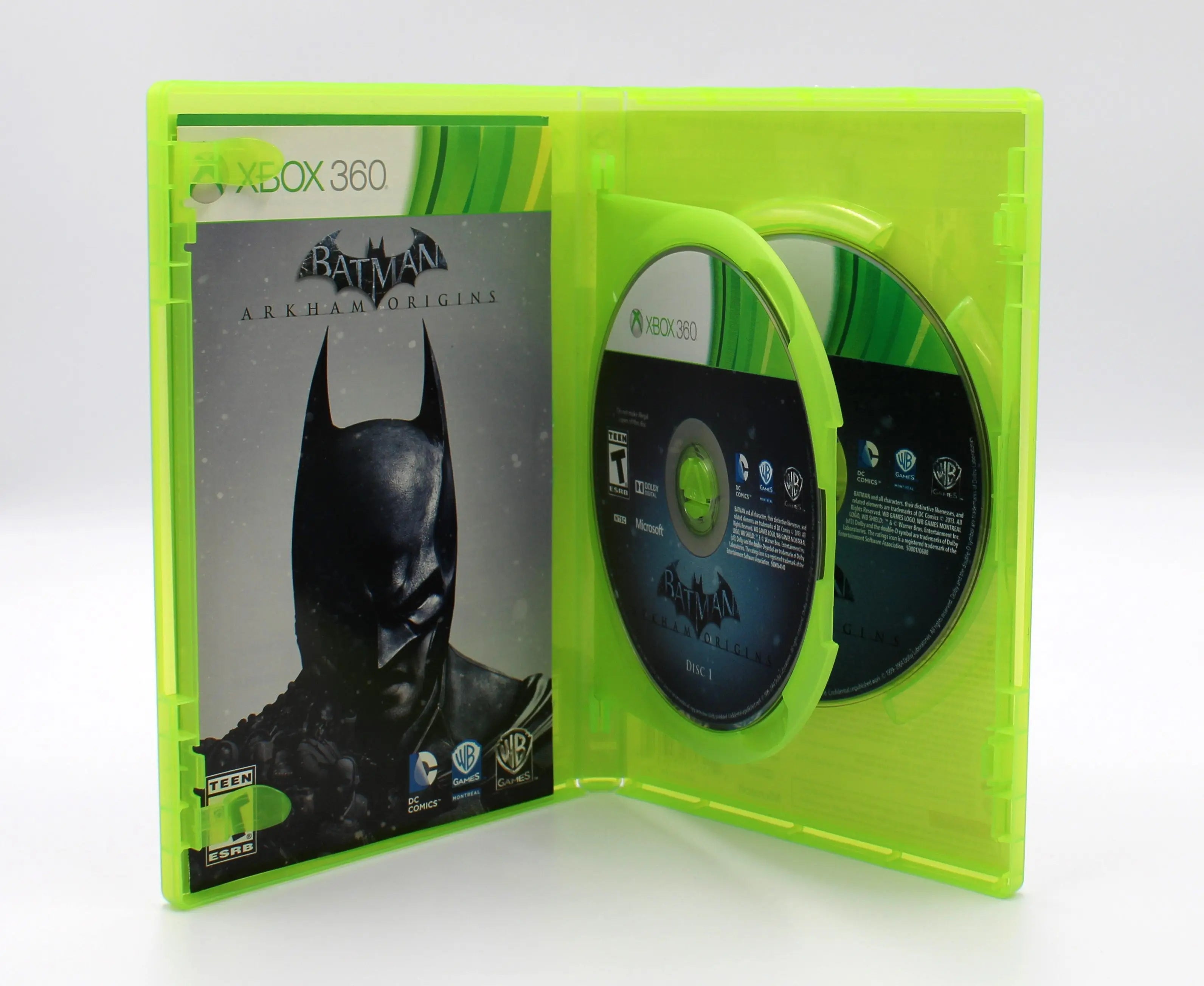 Open case view of Batman: Arkham Origins for Microsoft Xbox 360 NTSC-U, showing manual placement and both discs secured in tray.