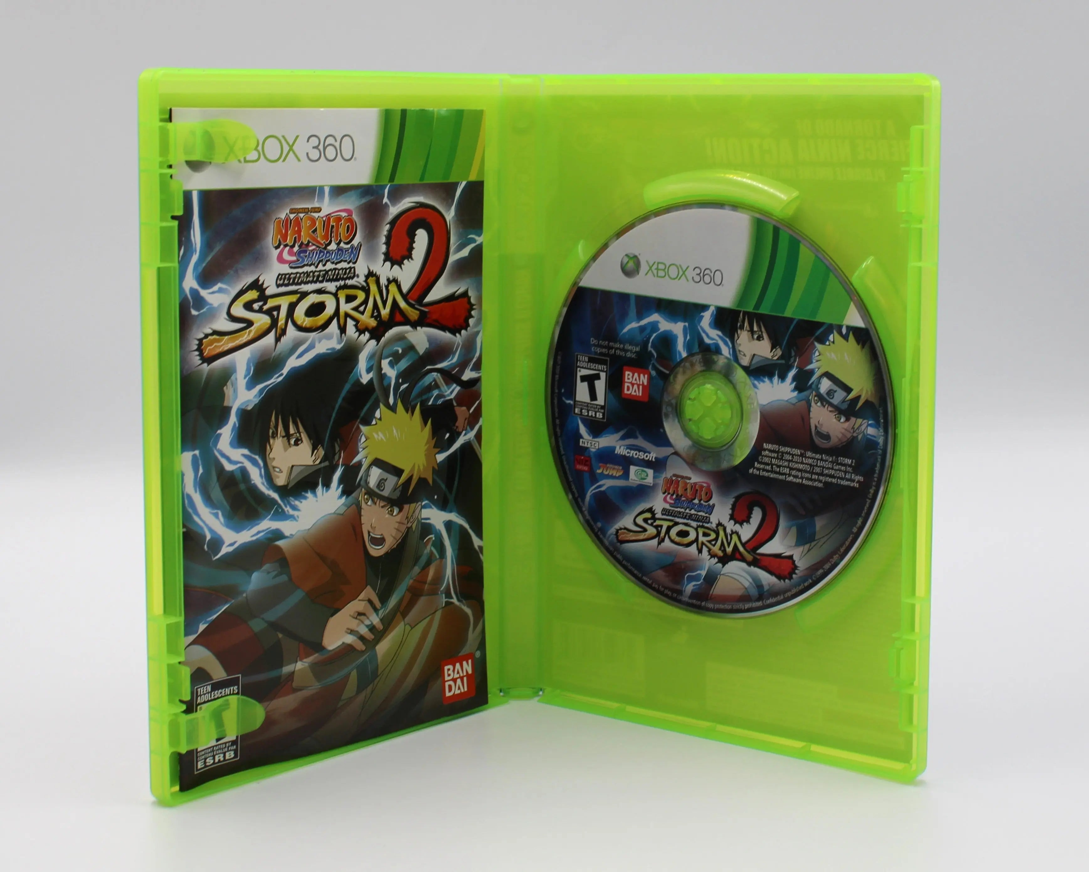 Open case view of Naruto: Rise of a Ninja for Microsoft Xbox 360 NTSC-U, showing manual placement and game disc secured in tray.