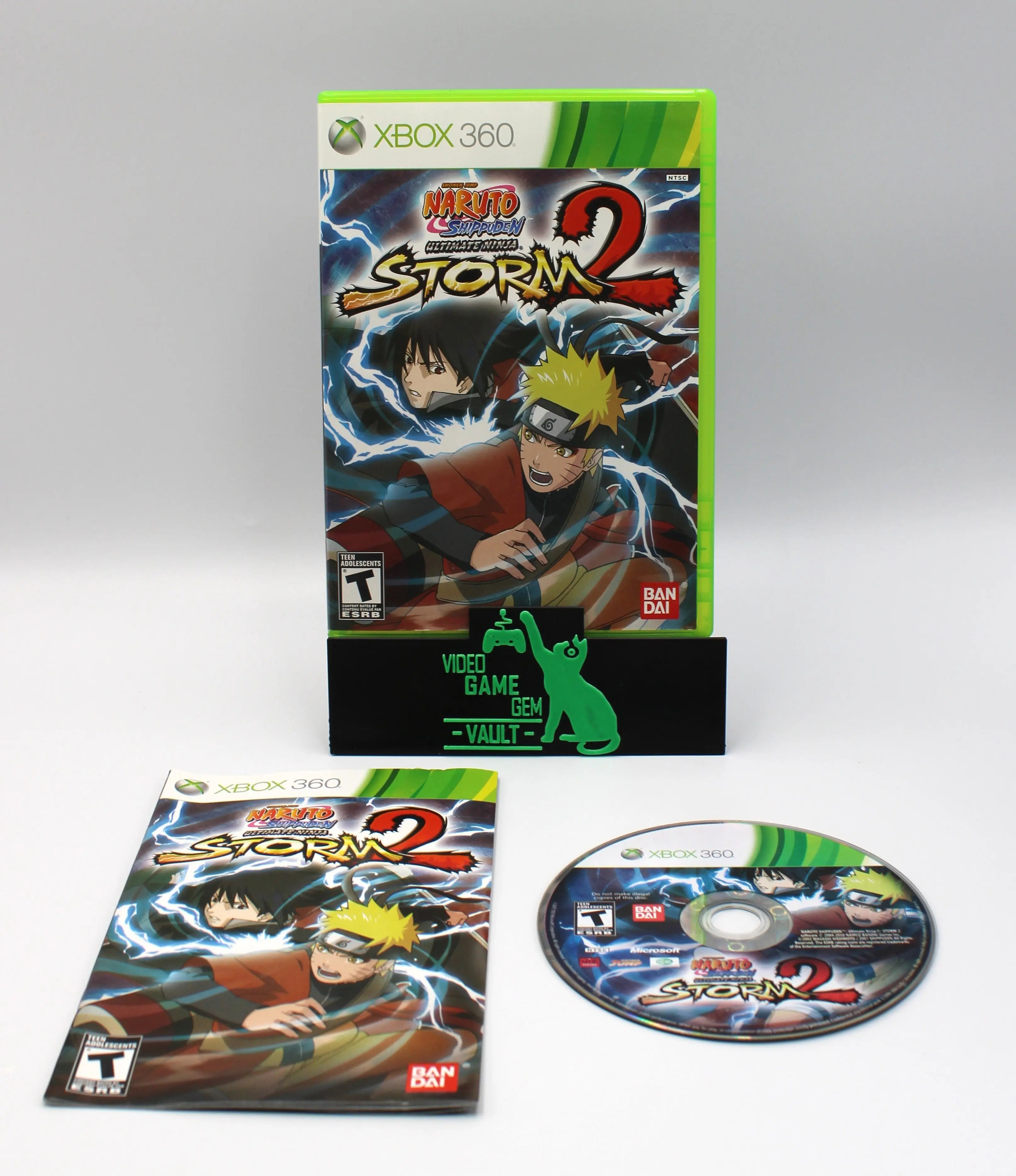 Main display of Naruto Shippuden: Ultimate Ninja Storm 2 for Microsoft Xbox 360 NTSC-U, showing complete game set with case, manual, and game disc.