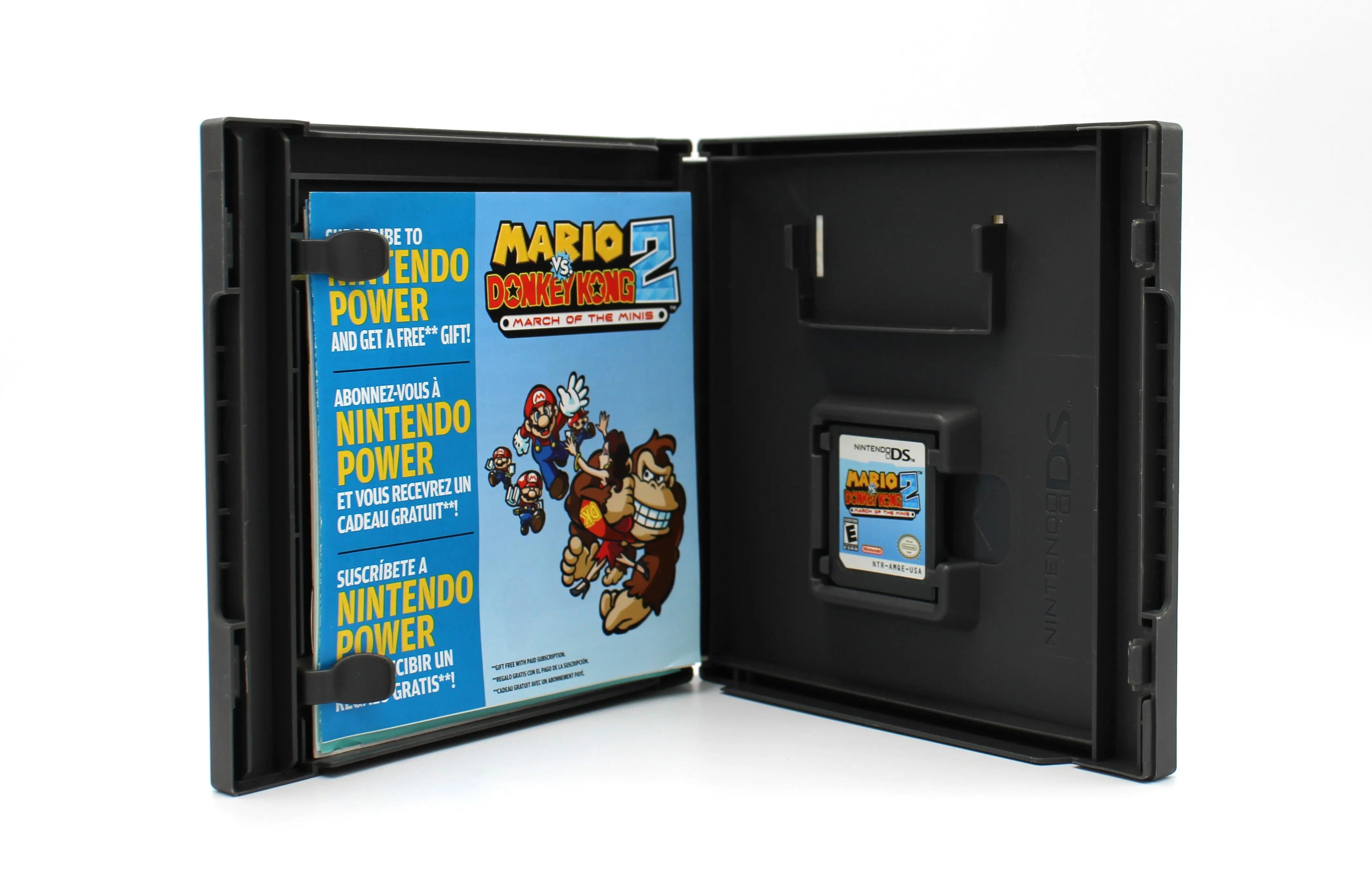 Open case image view of NTSC-U Mario vs. Donkey Kong 2: March of the Minis complete in box for Nintendo DS. (2006) CIB with all Inserts. Showing opened case with inserts and game cartridge in place in OEM case.
