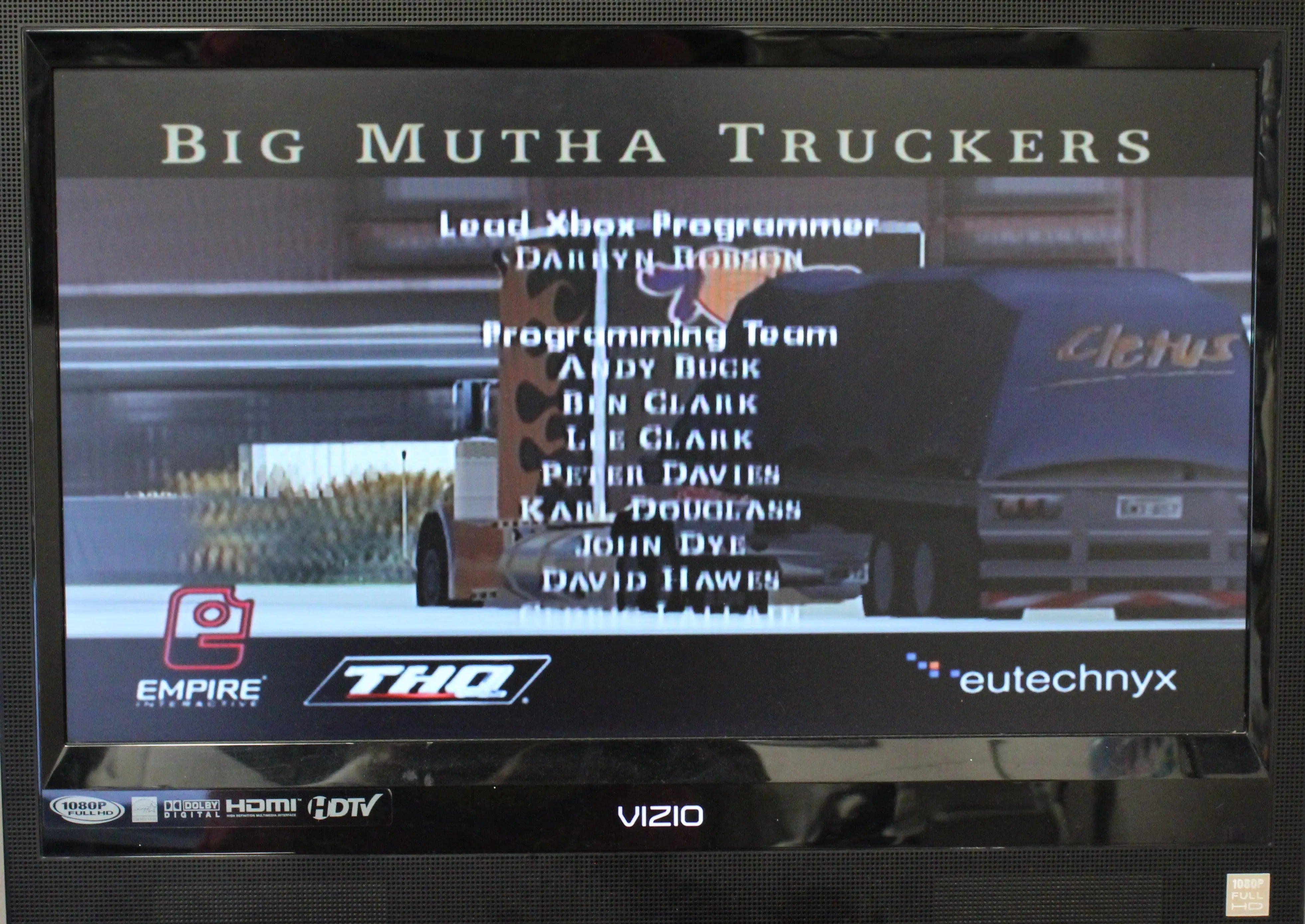 Gameplay credits image screenshot of Big Mutha Truckers for Microsoft Xbox Original NTSC-U, showing in-game racing action and visual style.