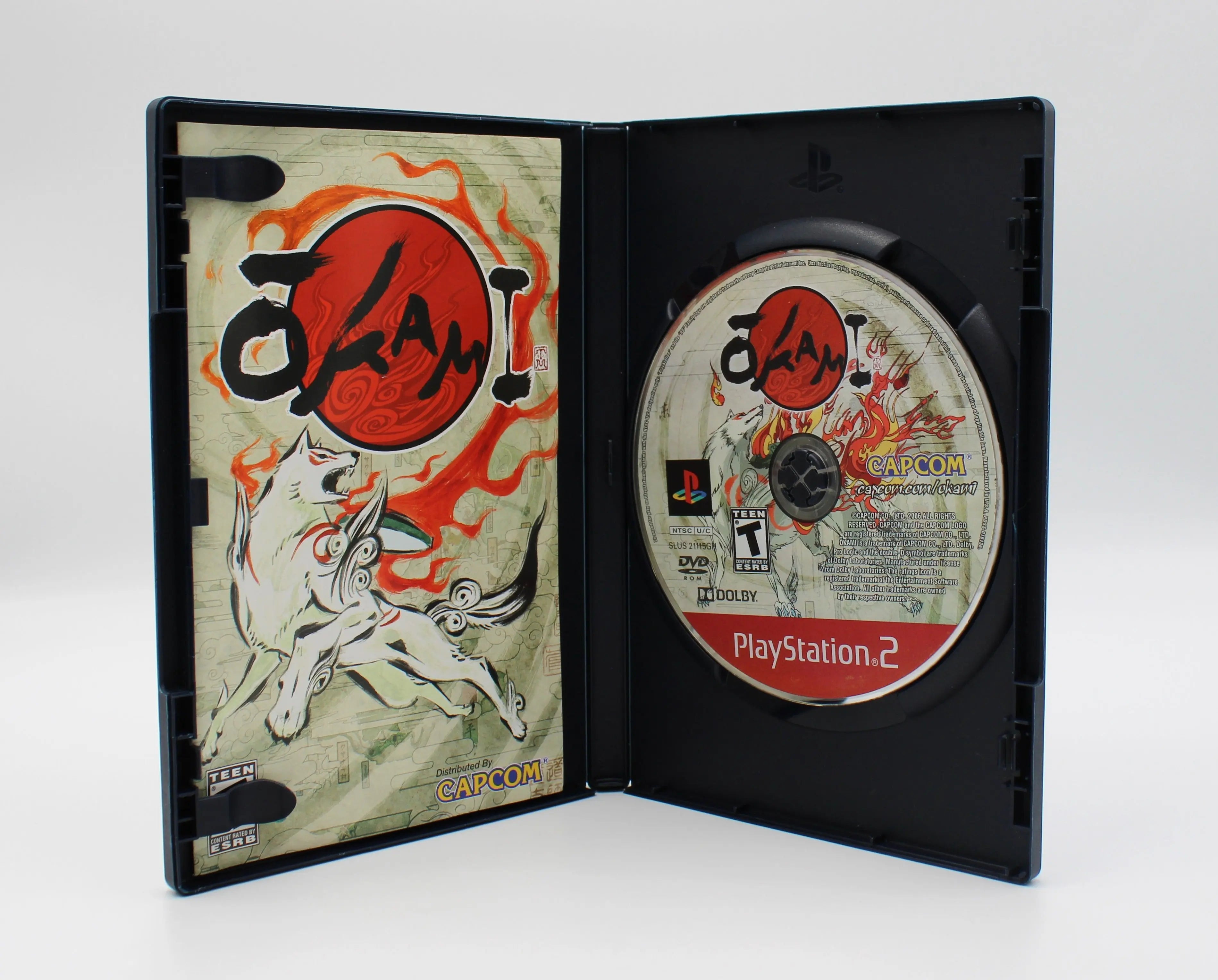 Open case image of Okami for Sony PlayStation 2 PS2 (2006), showing manual and game disc, Greatest Hits NTSC-U edition.