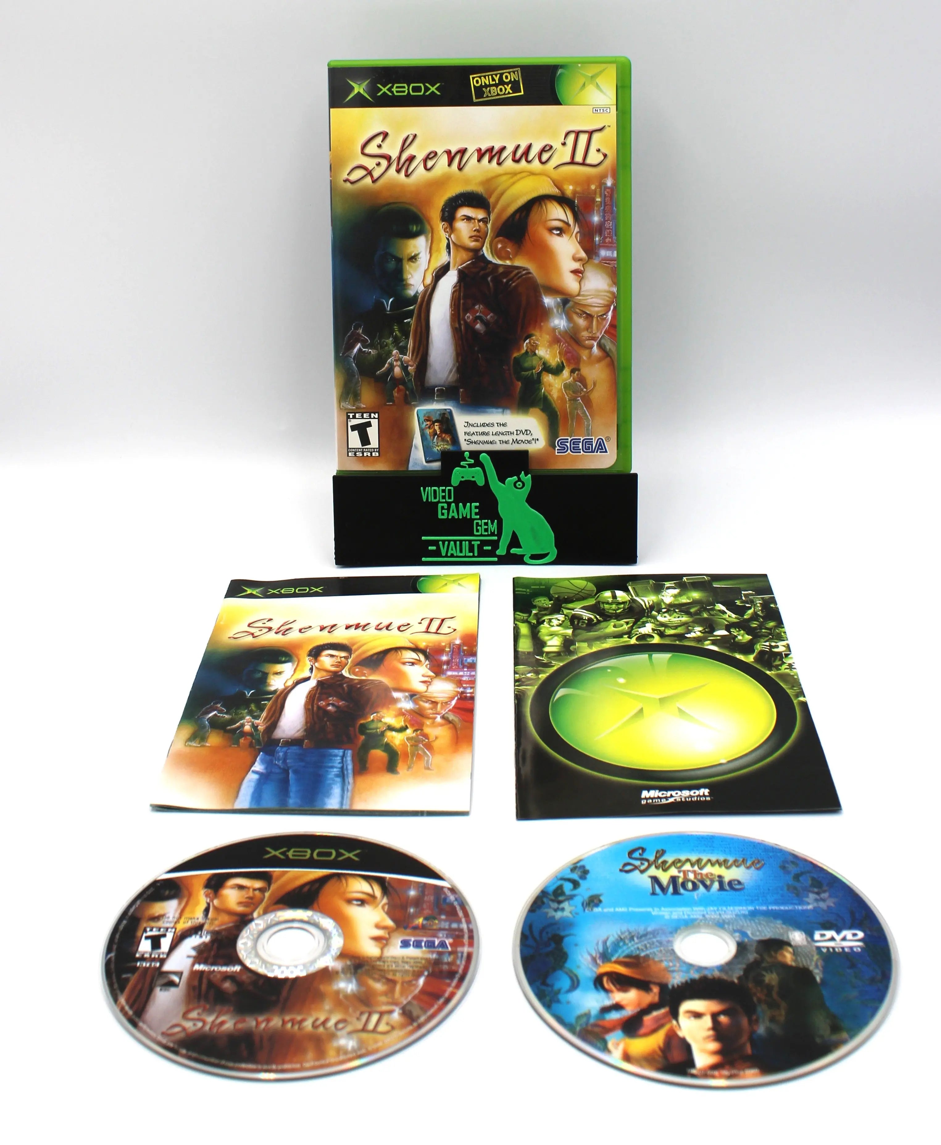 Main display of Shenmue II for Microsoft Xbox Original NTSC-U, showing complete game set with case, manual, game disc, and bonus DVD movie disc.