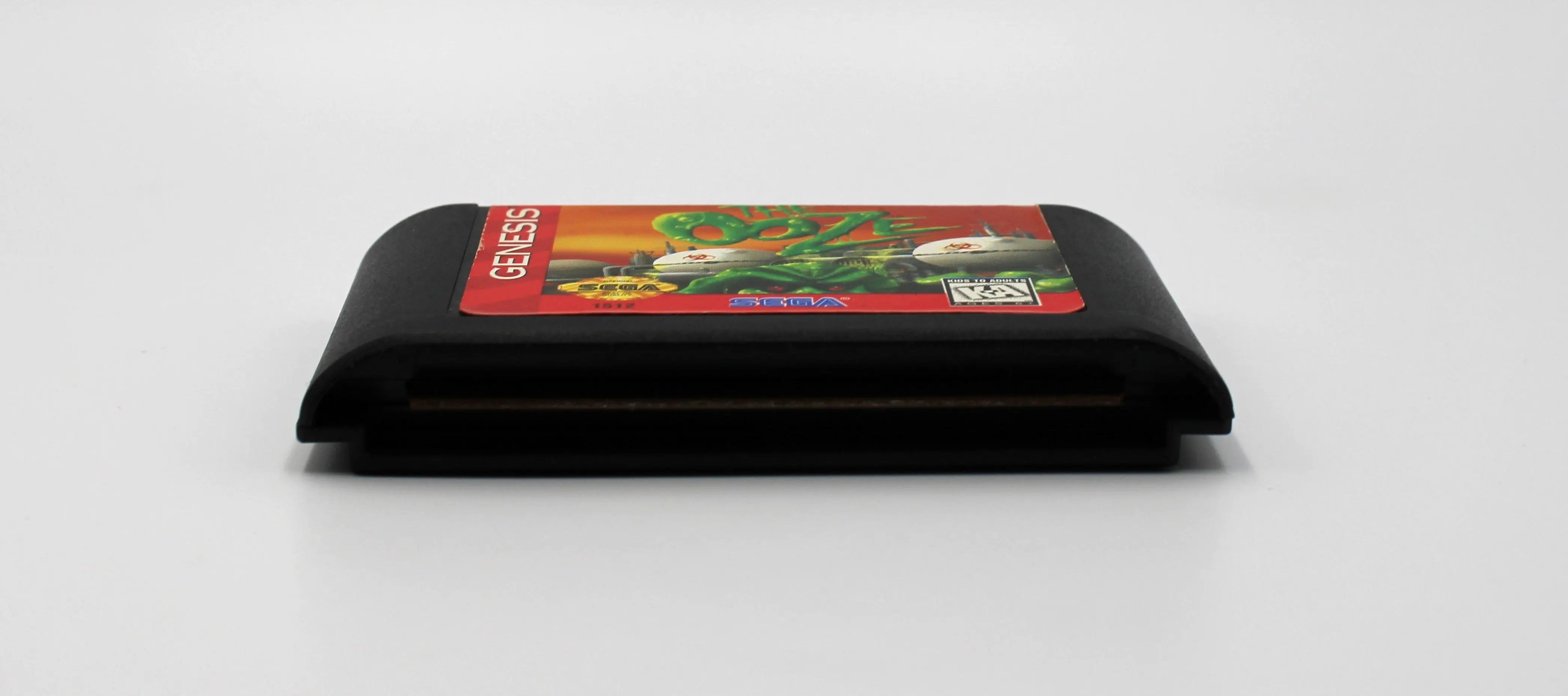 Bottom of cartridge view for The Ooze for Sega Genesis. 1995. NTSC-U Authentic Video Game Cartridge. See picture of polished cartridge pins.