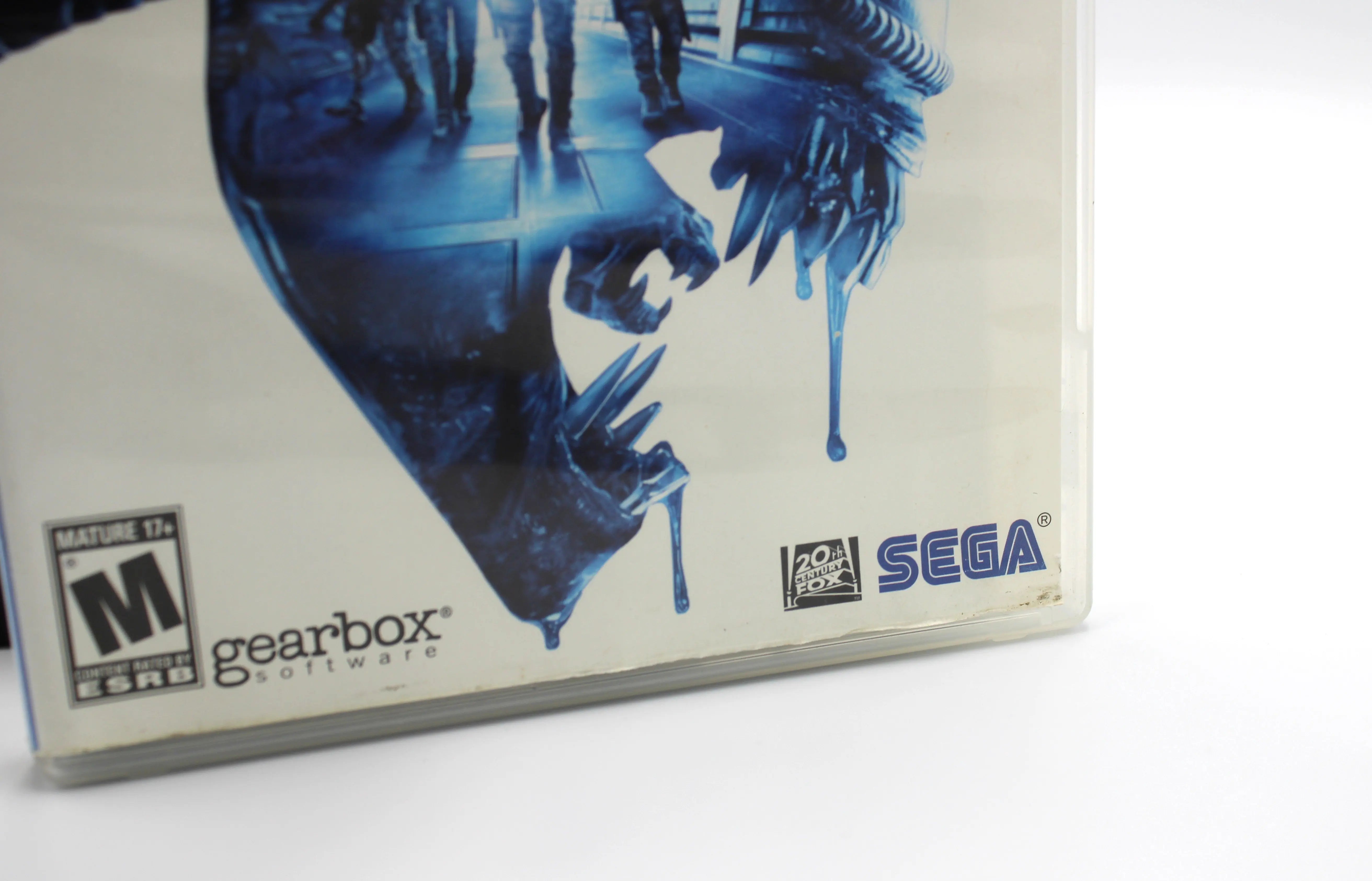 Angled exterior close‑up of the right side of the bottom OEM artwork of Aliens: Colonial Marines for Sony PlayStation 3 PS3 – CIB with manual (2013) NTSC‑U, showing light surface scratches and slight discoloration from manual handling.