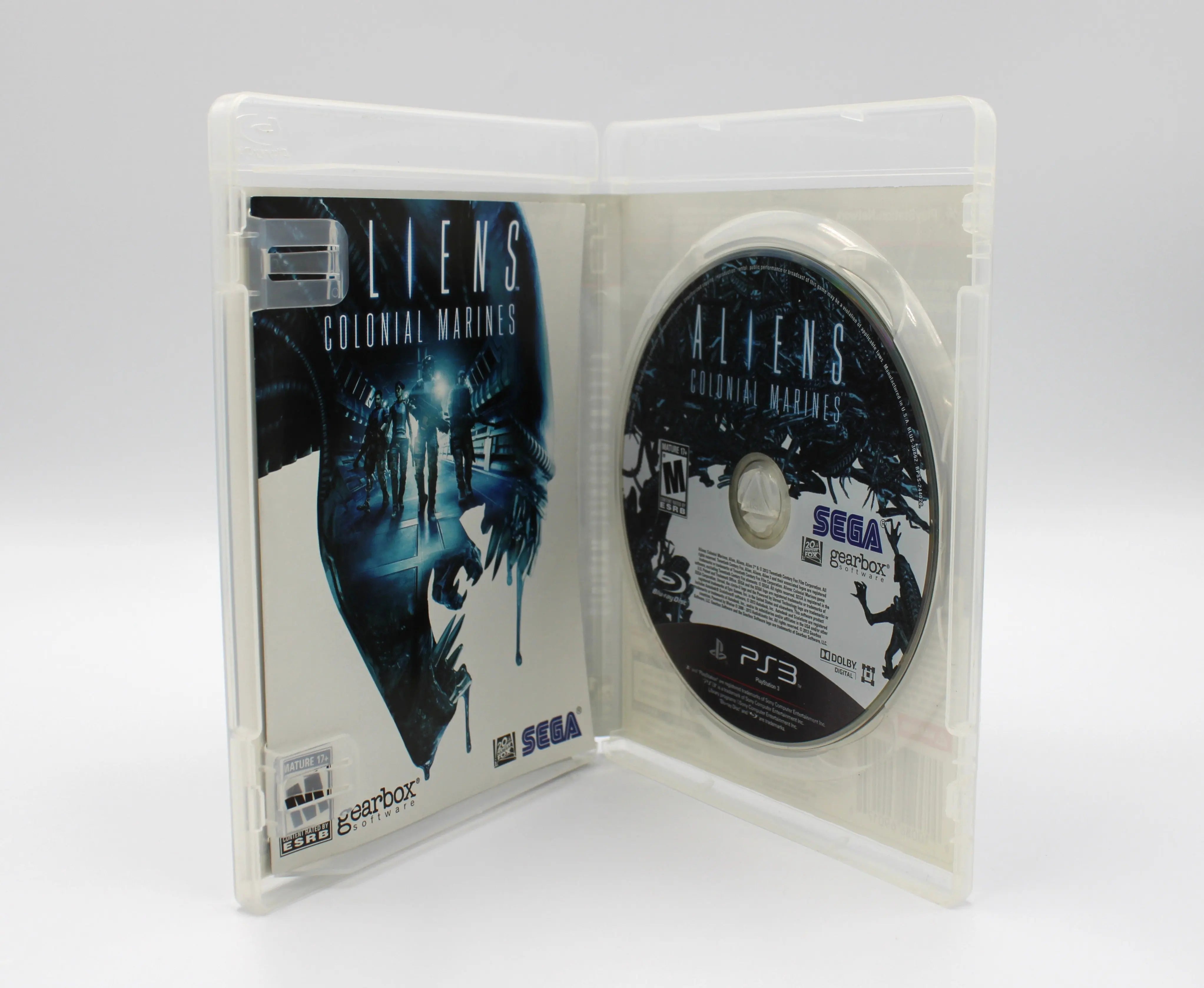 Open‐case view of Aliens: Colonial Marines for Sony PlayStation 3 PS3 – CIB with manual (2013) NTSC‑U, with the disc on the left hub and the multi‑page manual on the right sleeve.