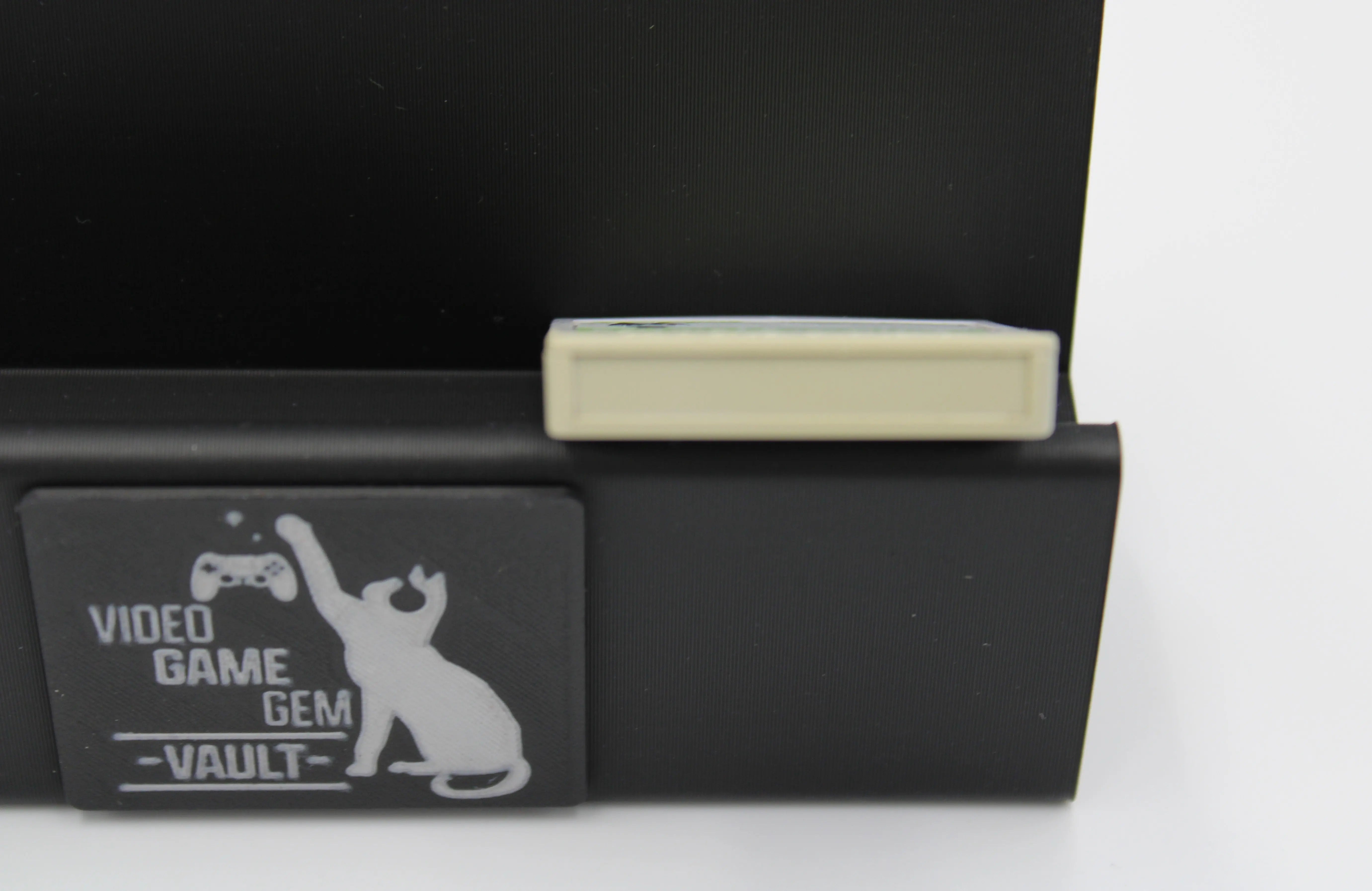 Bottom of image of 2002 released NTSC-U of OEM Animal Crossing Memory Card for Nintendo GameCube – 59 Blocks (DOL-008). Displaying authentic grey Animal Crossing memory card highlighting the bottom to show minor discoloration or yellowing to that area specifically.