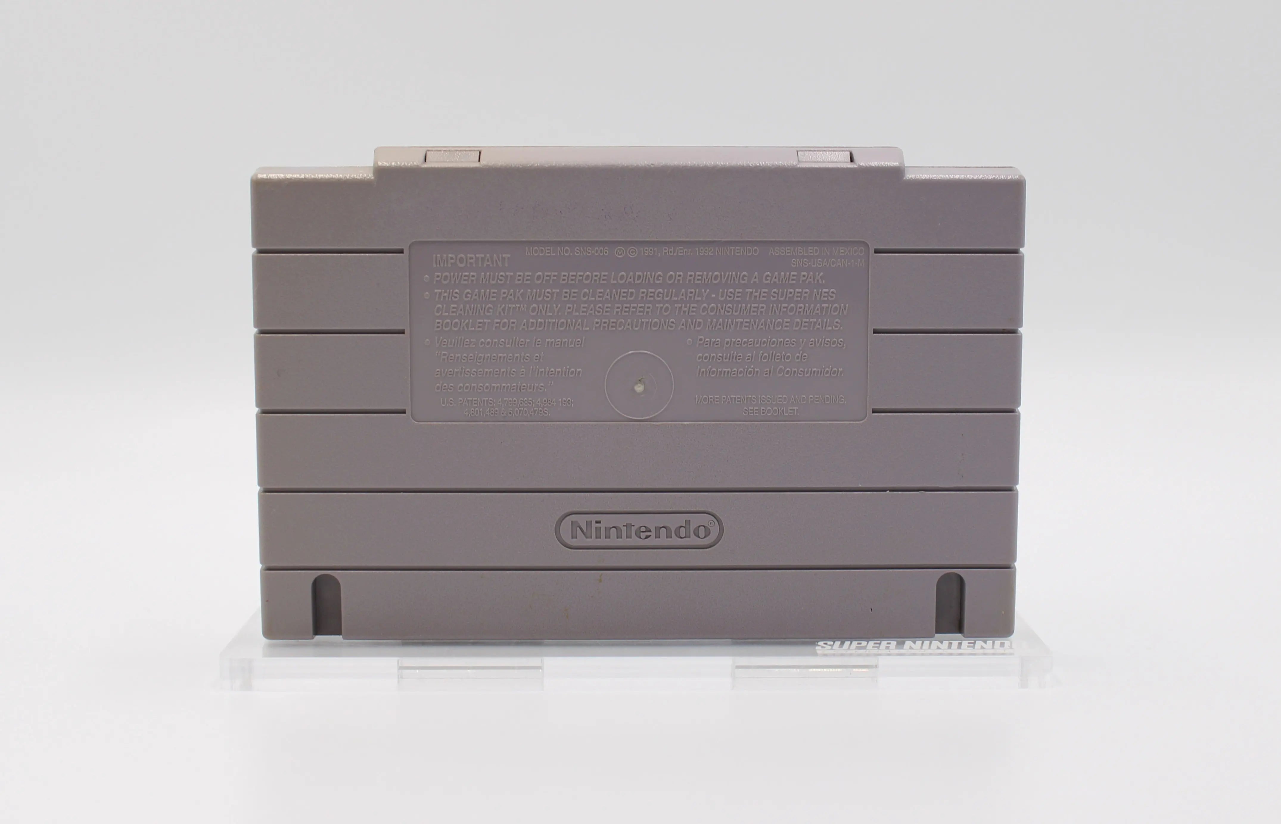 Back cartridge view of retro SNES game WWF Super WrestleMania. See picture of back of the NTSC-U cartridge with Nintendo text and dates.