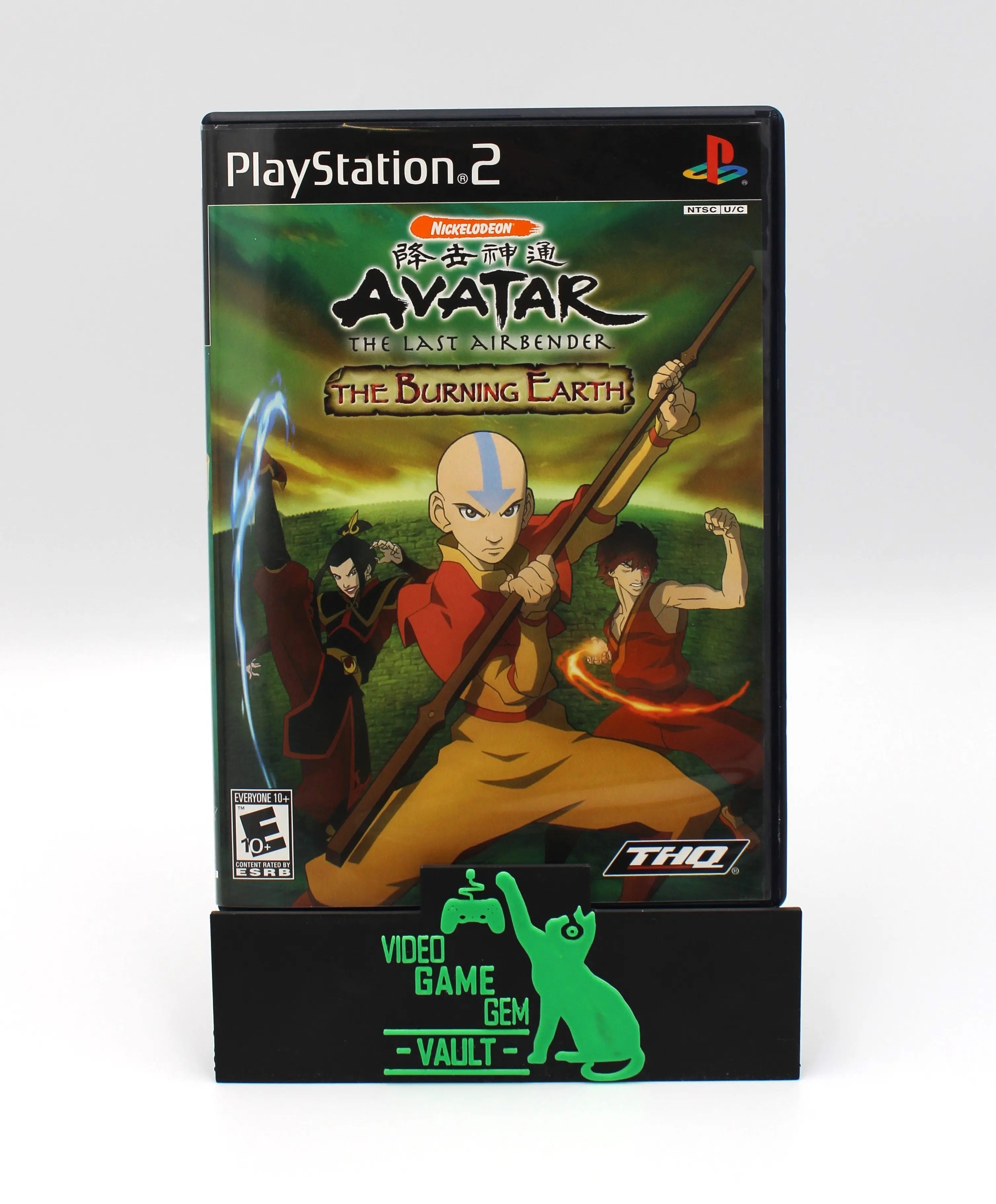 Front cover of Avatar: The Last Airbender – The Burning Earth for PS2 NTSC-U, showing Aang and other characters in dynamic poses with elemental effects.