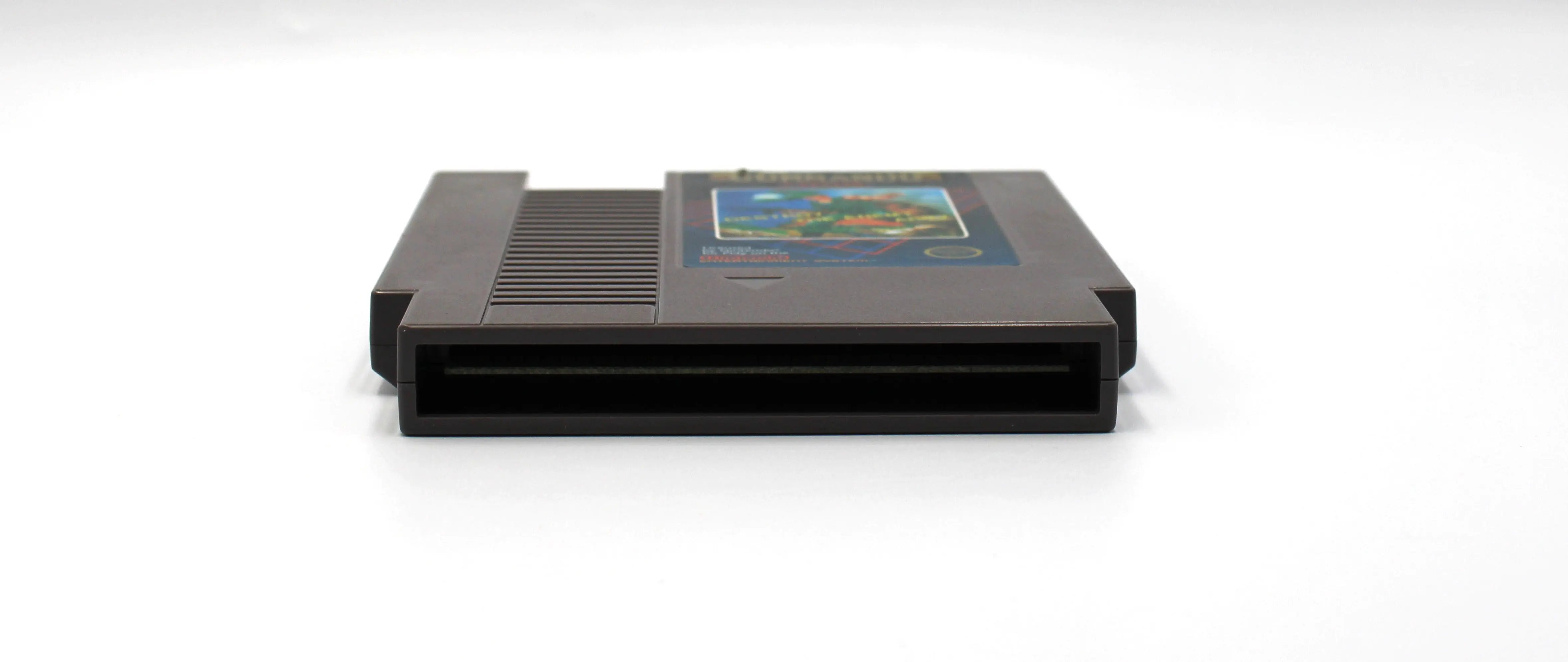 Pins and bottom image of Commando for Nintendo NES (1986), showing connector pins and bottom shell design for authenticity.