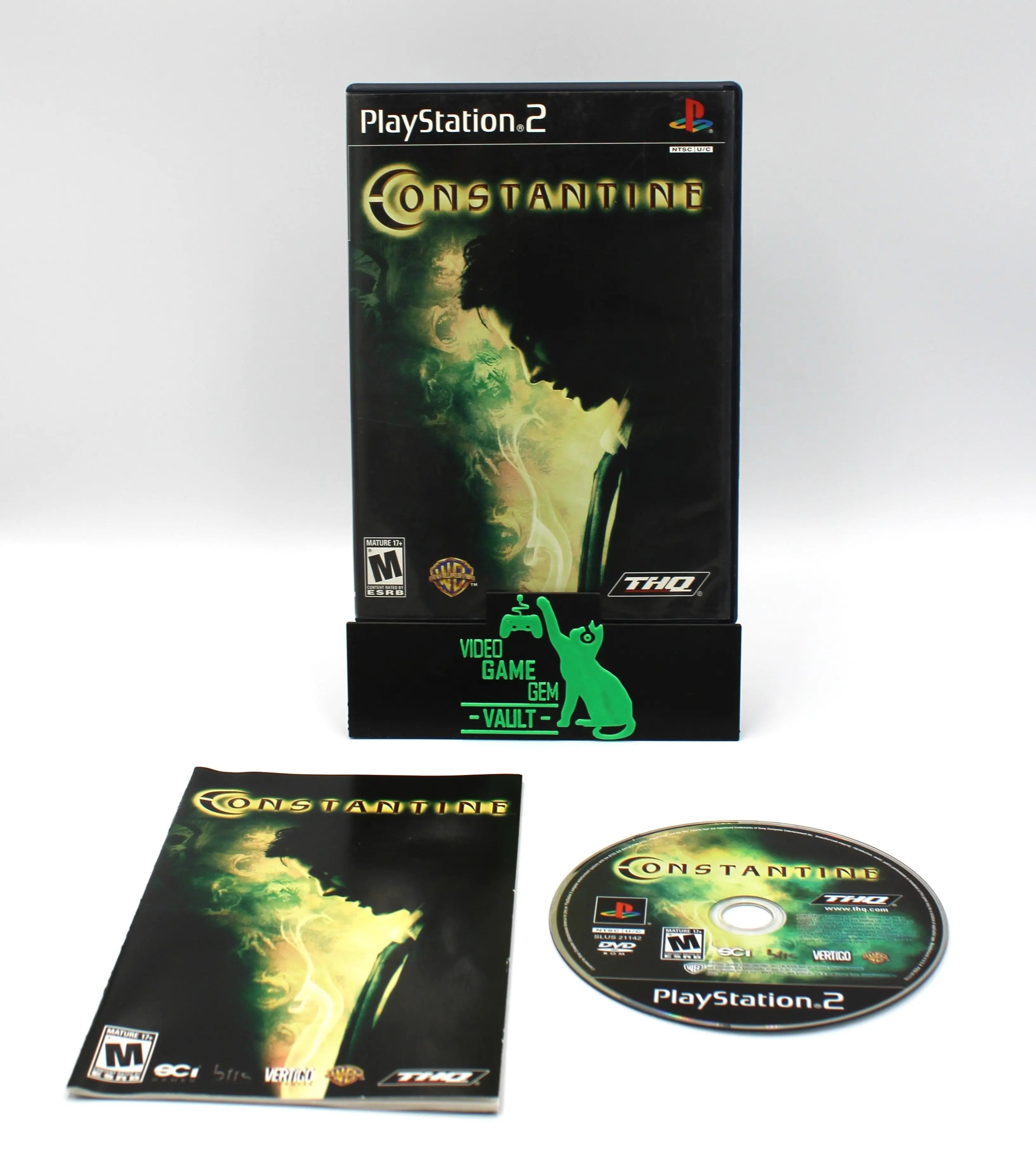 Main display image of Constantine for Sony PlayStation 2 PS2 (2005), showing case, manual, and game disc, NTSC-U edition.