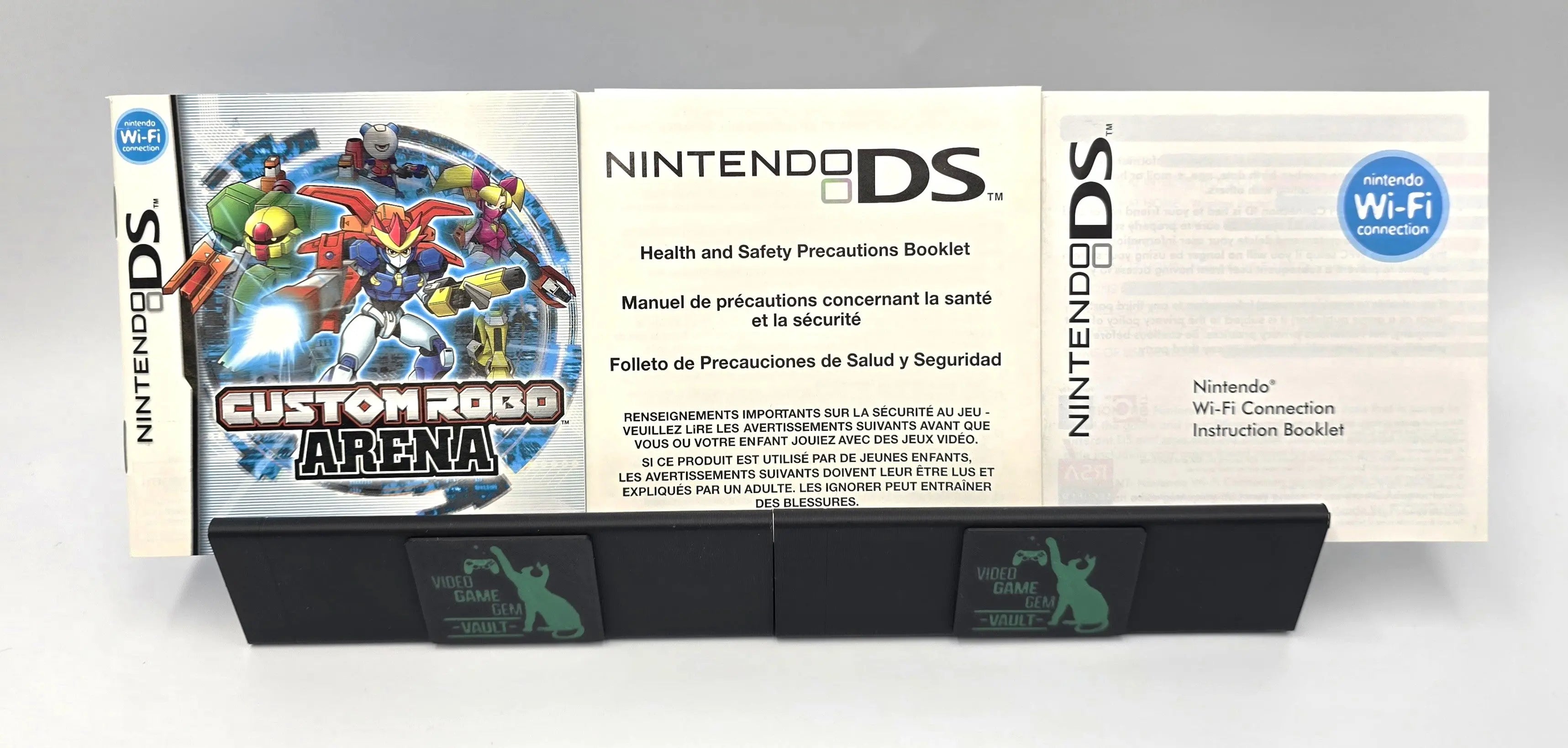 Original inserts and manual for Custom Robo Arena on Nintendo DS – NTSC-U. Includes health & safety precautions booklet and Wi-Fi instruction booklet.