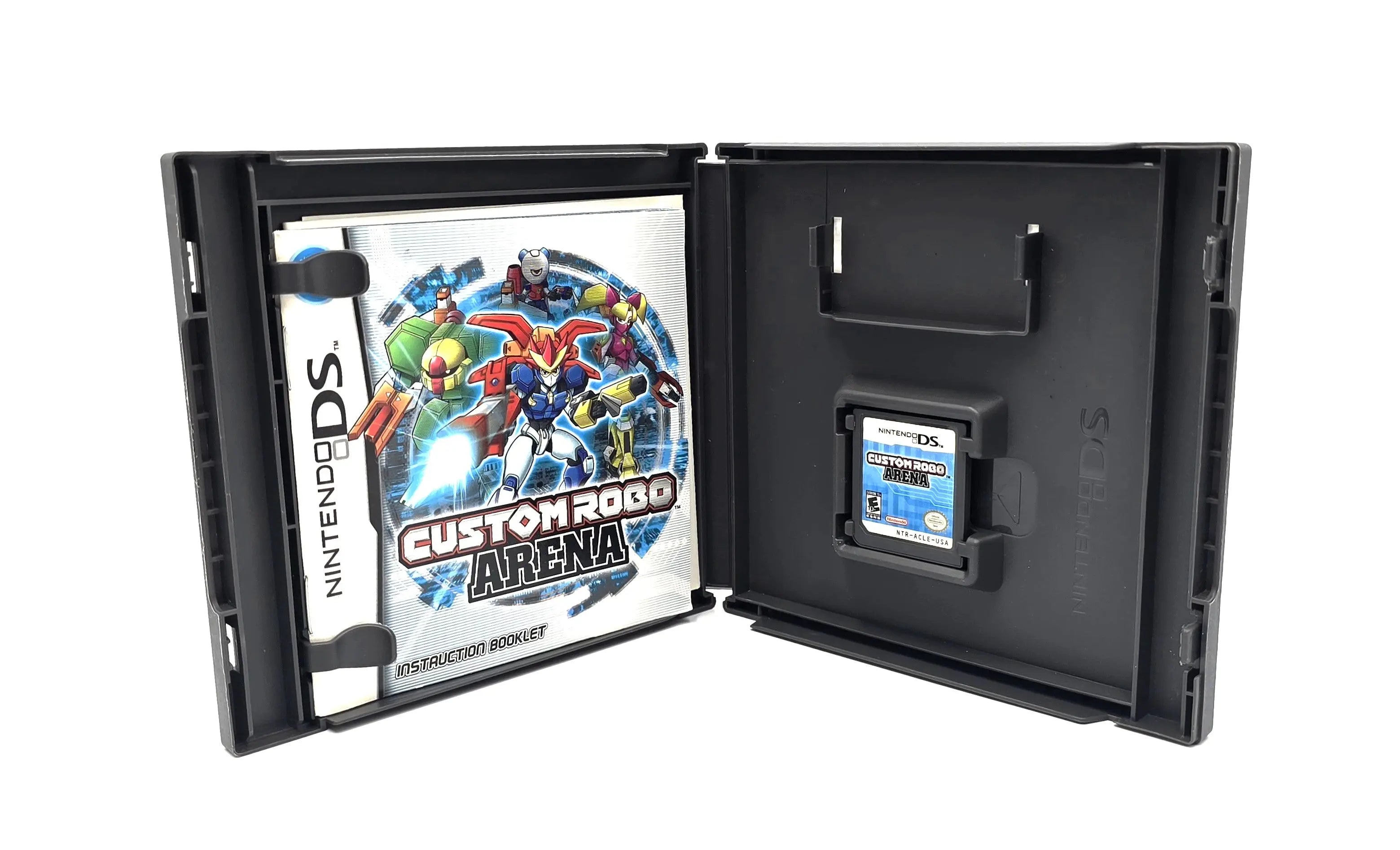 Open case view of Custom Robo Arena for Nintendo DS – Complete in Box (2007) NTSC-U, with instruction booklet and authentic cartridge secured inside.