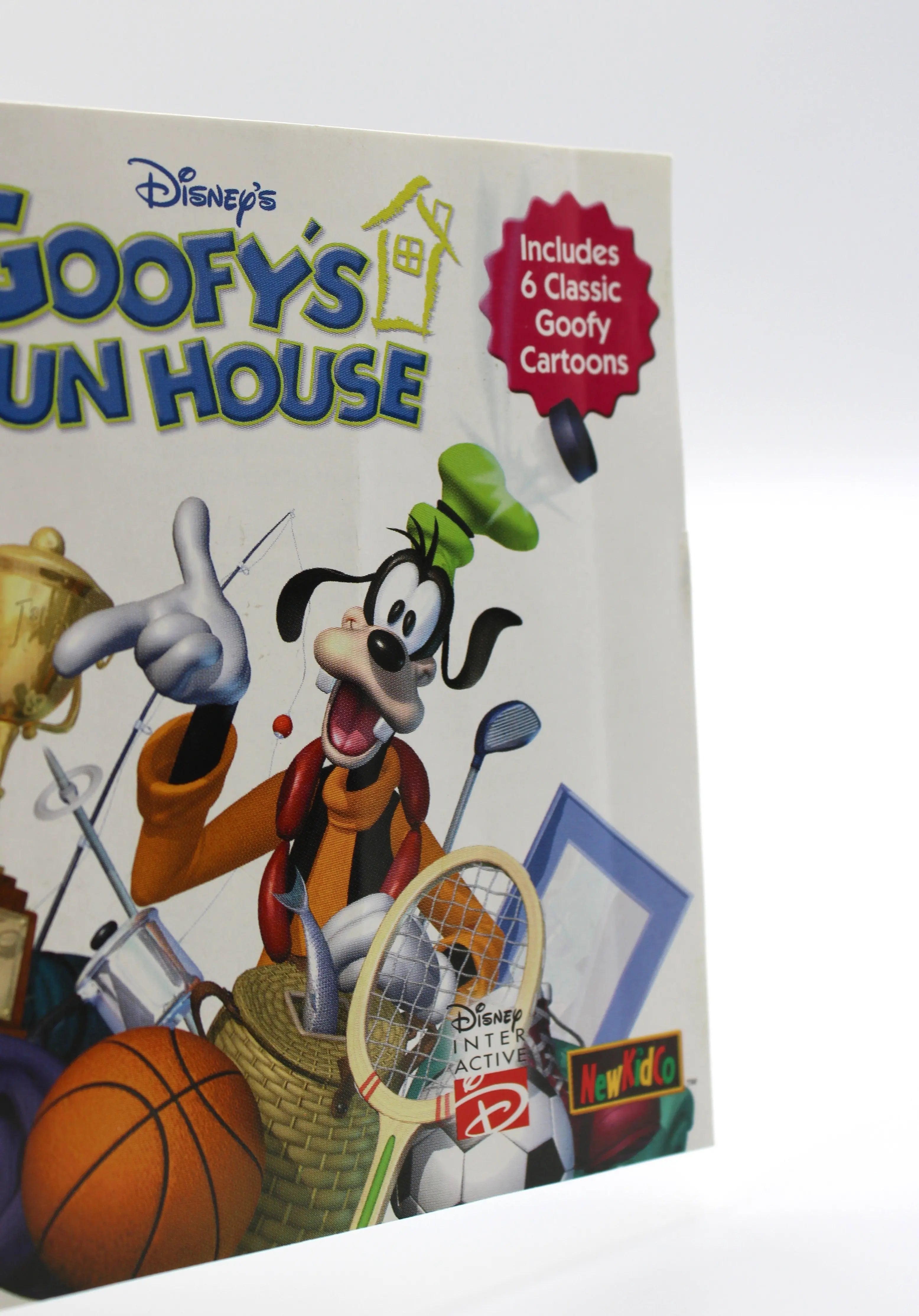 Close‑up of manual front cover artwork for Disney’s Goofy’s Fun House for Sony PlayStation 1 PS1 – CIB with Reg Card (2001) NTSC‑U, showing minor wear and edge creasing on the front artwork.