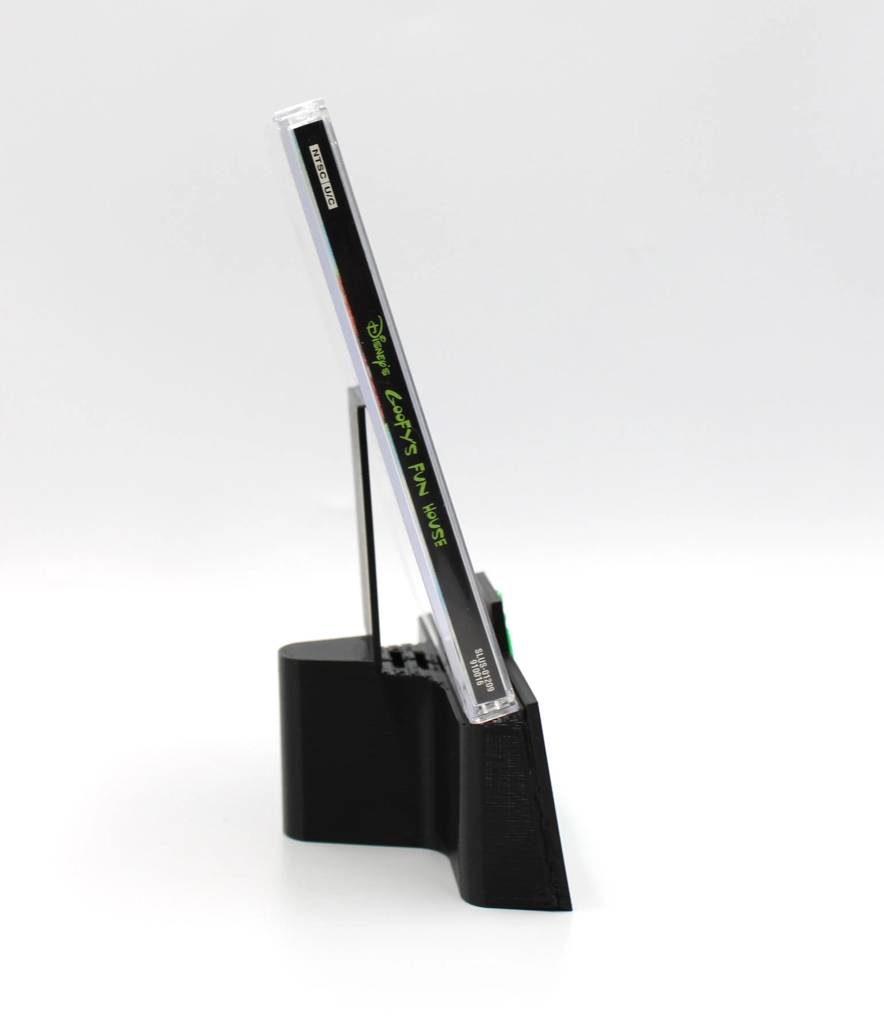 Left Spine view of Disney’s Goofy’s Fun House for Sony PlayStation 1 PS1 – CIB with Reg Card (2001) NTSC‑U, showing clear title text and case color.