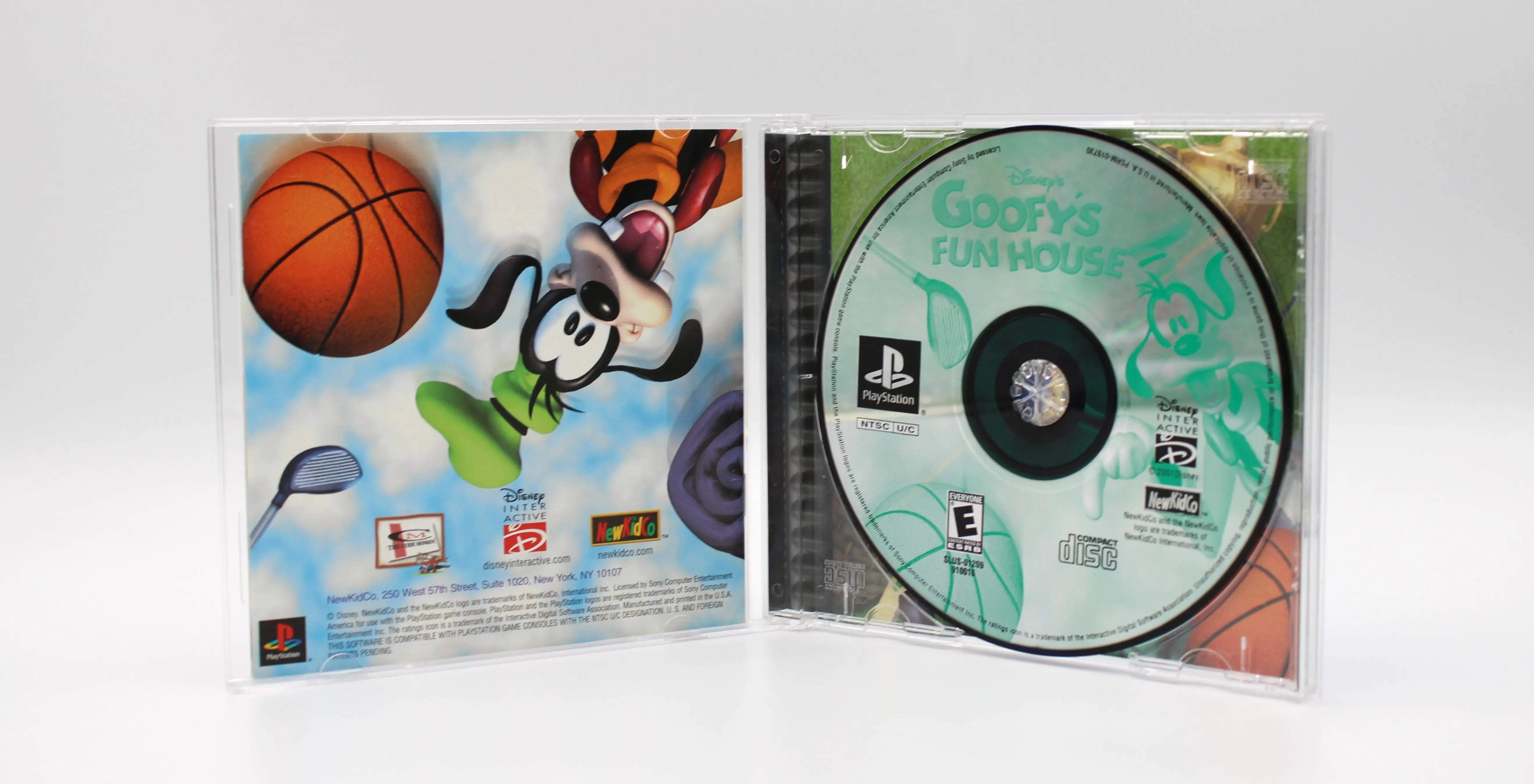 Opened case interior of Disney’s Goofy’s Fun House for Sony PlayStation 1 PS1 – CIB with Reg Card (2001) NTSC‑U, displaying disc on the right and manual with registration card on the left.