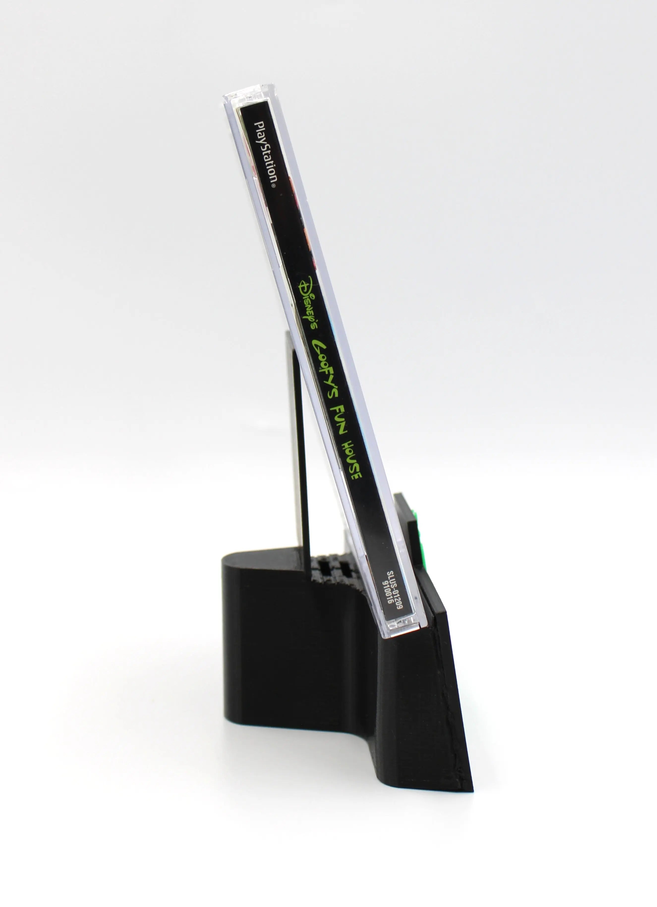 Right Spine view of Disney’s Goofy’s Fun House for Sony PlayStation 1 PS1 – CIB with Reg Card (2001) NTSC‑U, showing clear title text and case color.