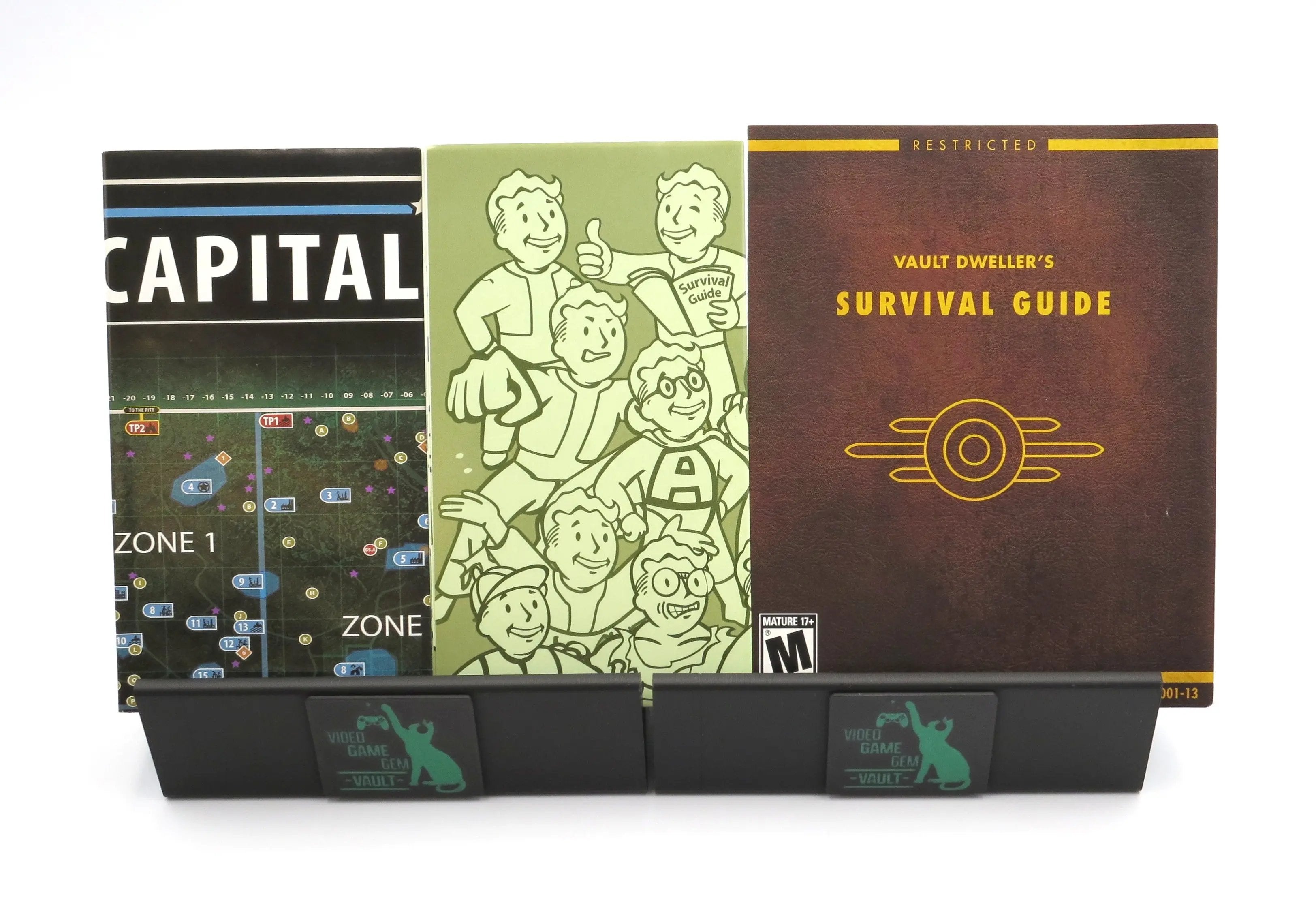 Front facing of three inserts for 'Fallout 3' Game of the year edition G.OT.Y.E Greatest Hits Complete in box for the Sony PlayStation 3 on a white background. Vault Dweller's Survival Guide, map, and manual.