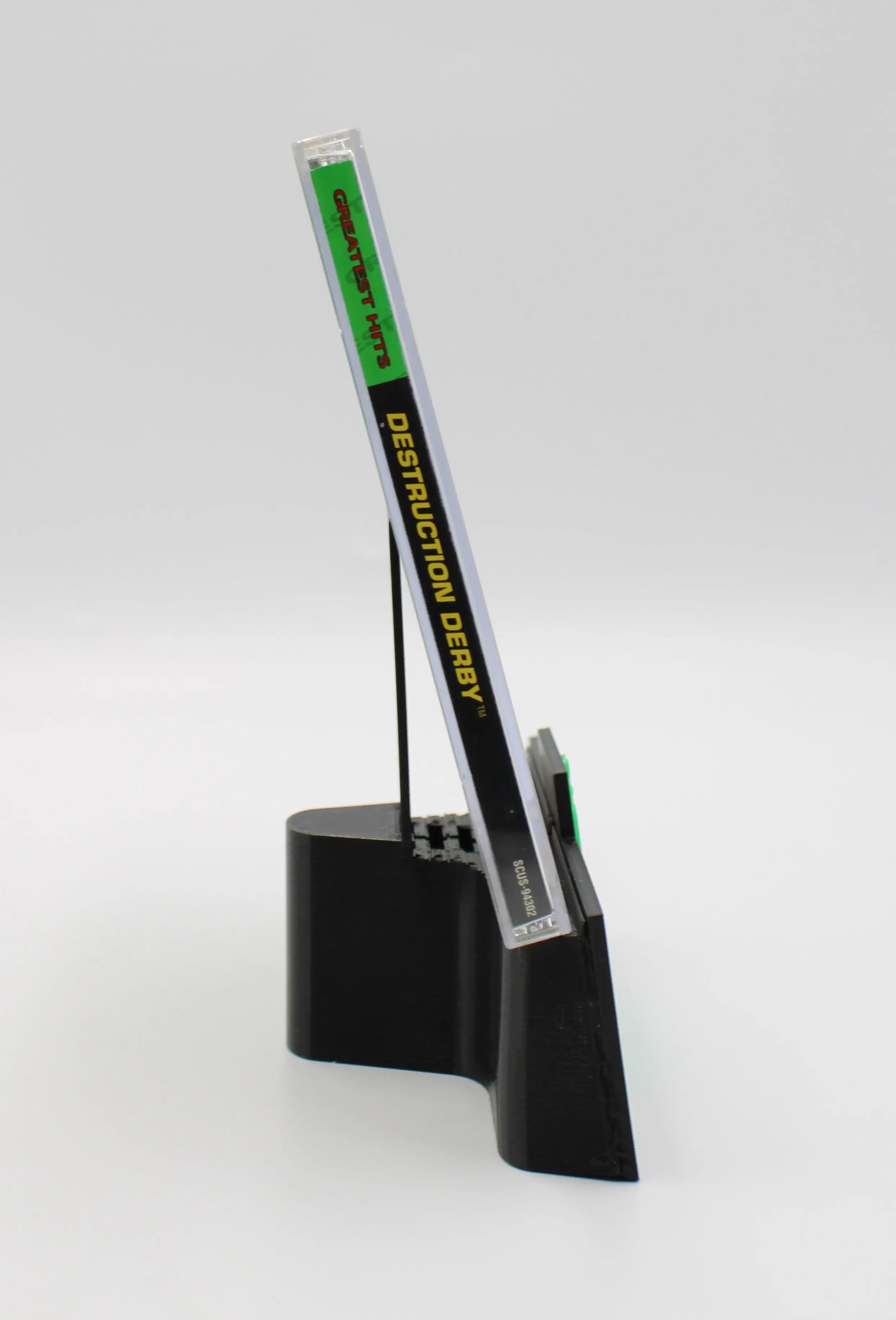 Spine view of Destruction Derby for Sony PlayStation 1 PS1 NTSC-U Greatest Hits Edition game case, showing title text and case alignment.