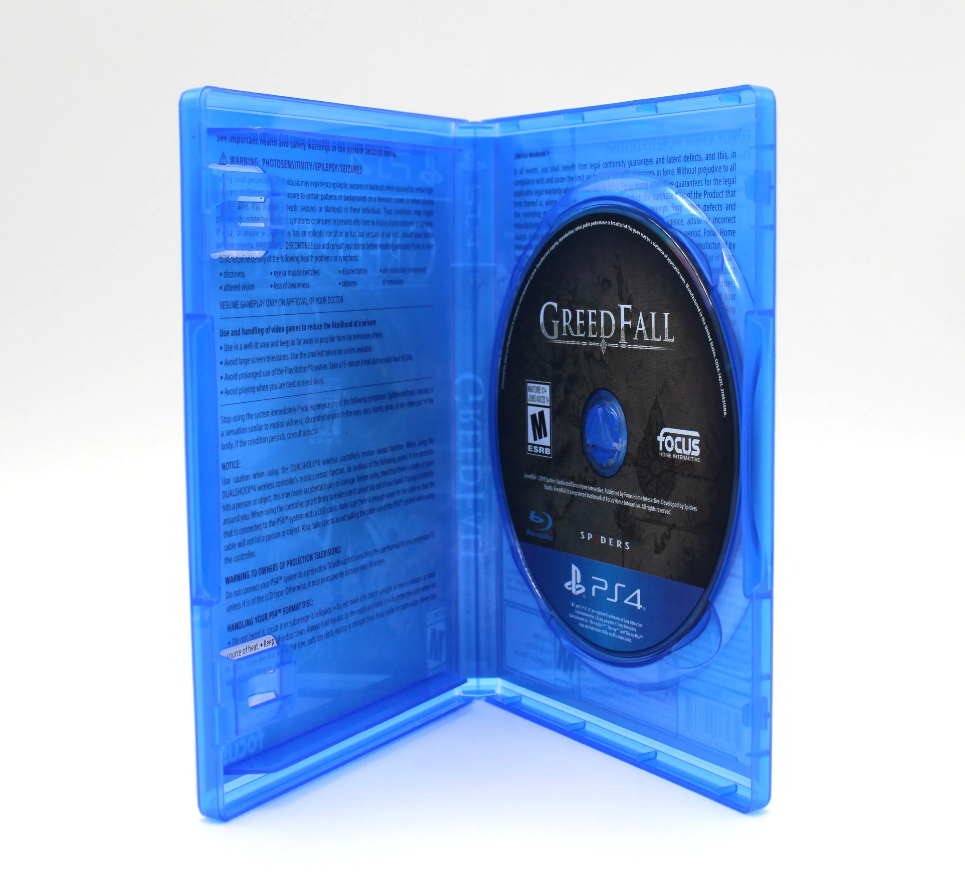 Opened case of Greedfall for Sony PlayStation 4 PS4 (2019) NTSC‑U, displaying the disc on the hub and clean OEM blue Sony PlayStation 4 case.