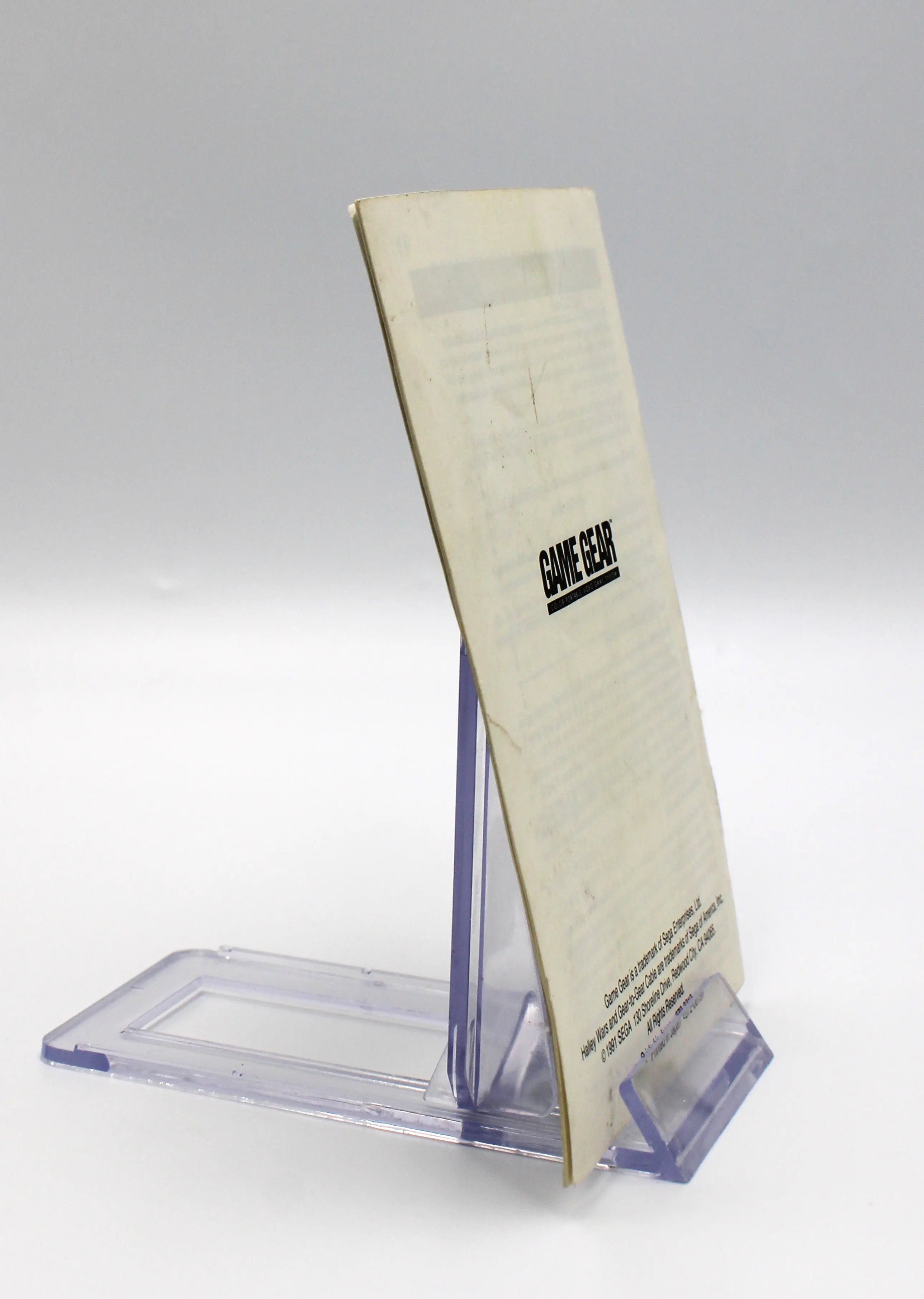 Side profile of Halley Wars manual, highlighting the thickness, page edges, and binding.