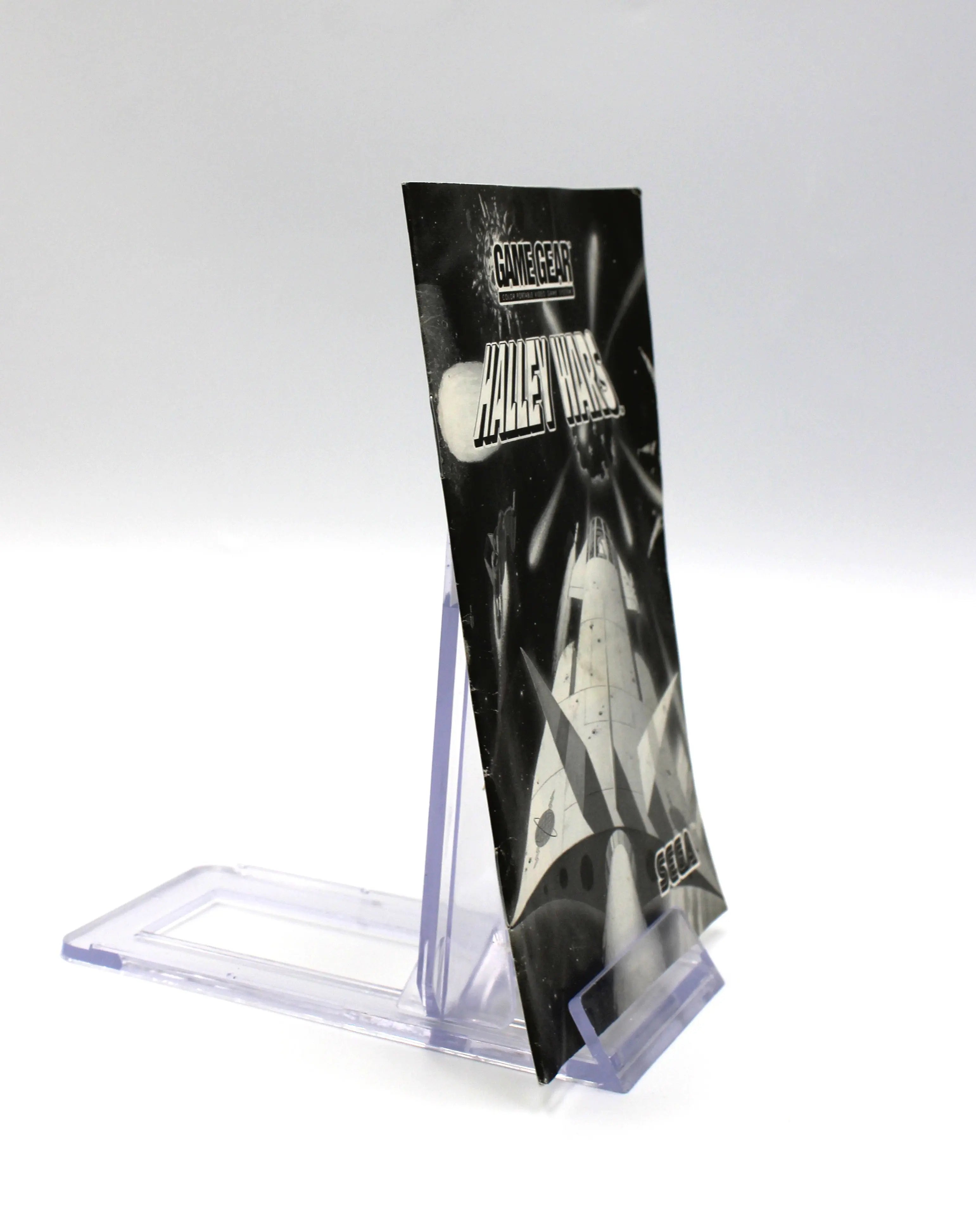 Spine of Halley Wars manual, showing the title text and staple binding along the left edge.