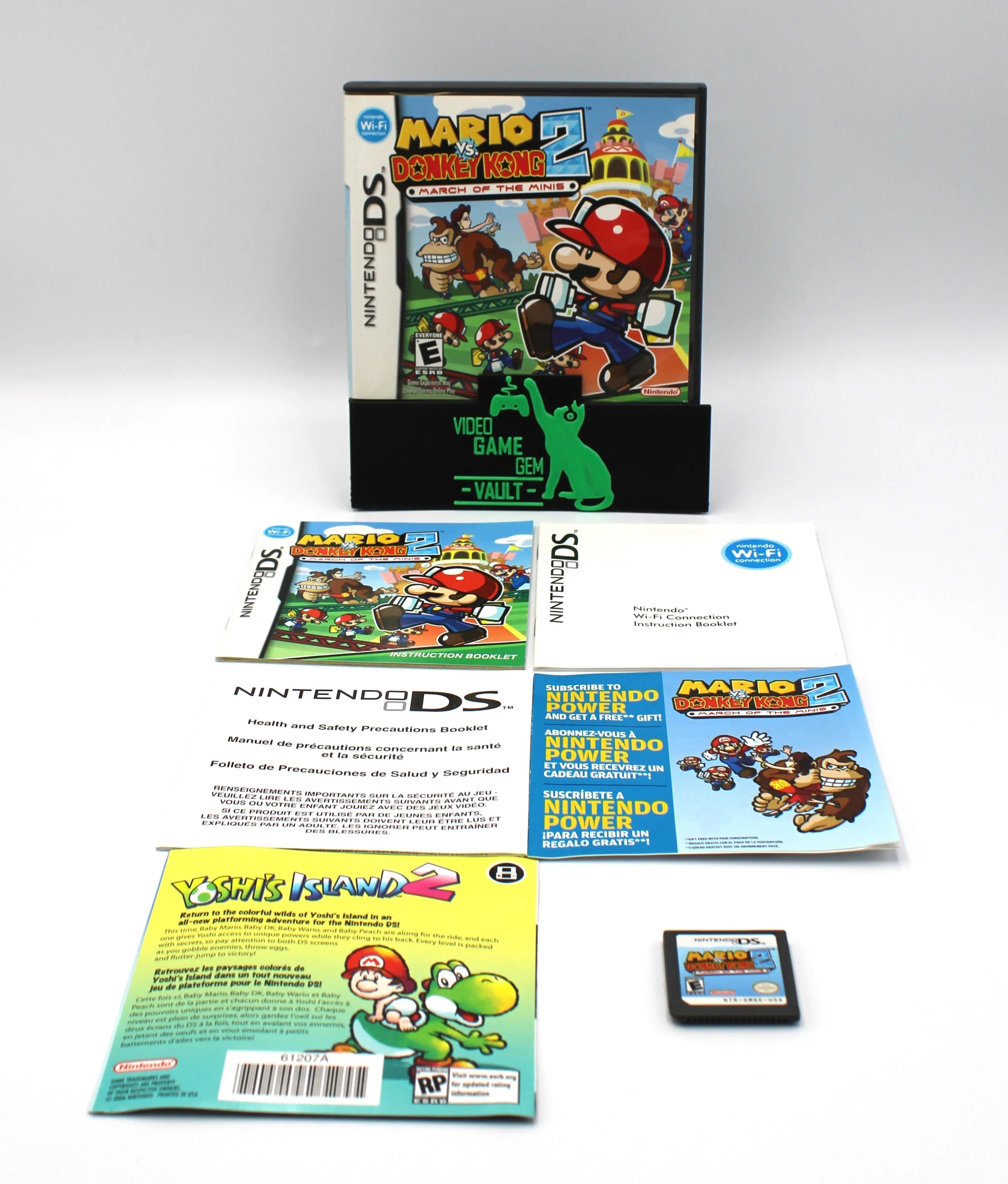 Overall complete view of NTSC-U Mario vs. Donkey Kong 2: March of the Minis complete in box for Nintendo DS. (2006) CIB with all Inserts. Showing case, five inserts, and authentic game cartridge.
