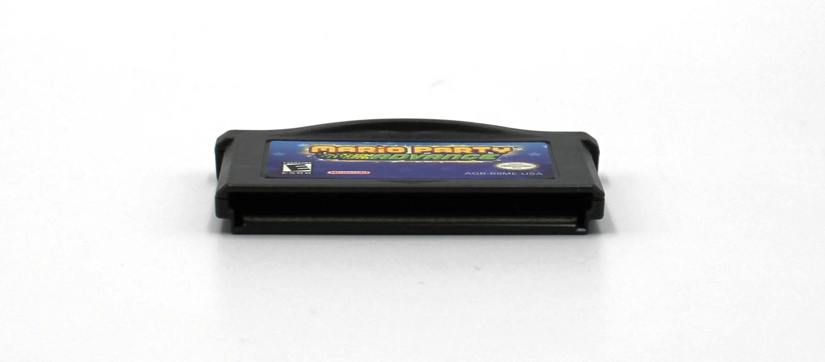 Bottom view of authentic copy of NTSC-U Mario Party Advance for the Nintendo Game Boy Advance, GBA. See picture of the cartridge pins.