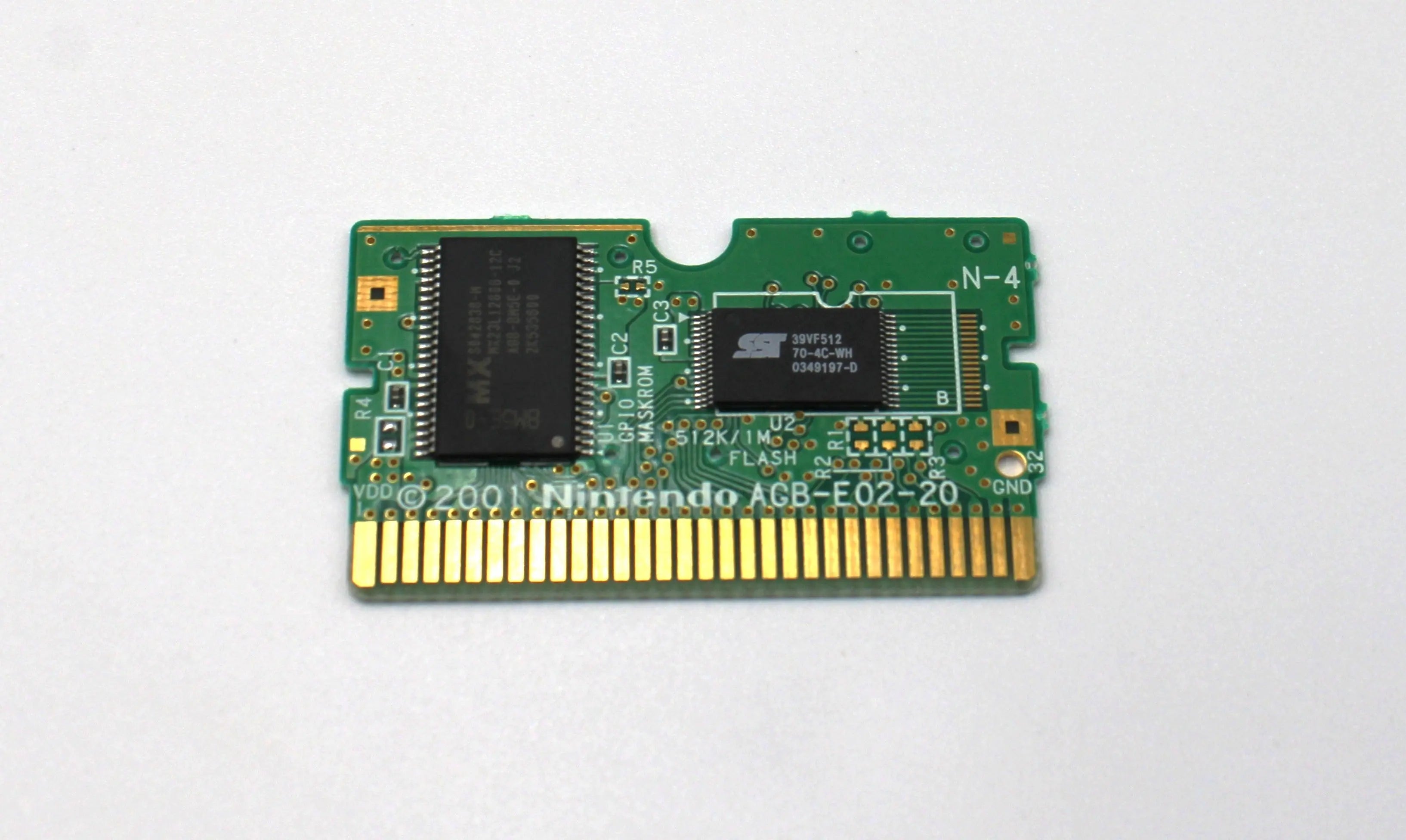 Internal board view (front side) of Mario vs. Donkey Kong for Nintendo Game Boy Advance GBA – Authentic Game Cartridge (2004) NTSC-U, showing chip layout and Nintendo etching.