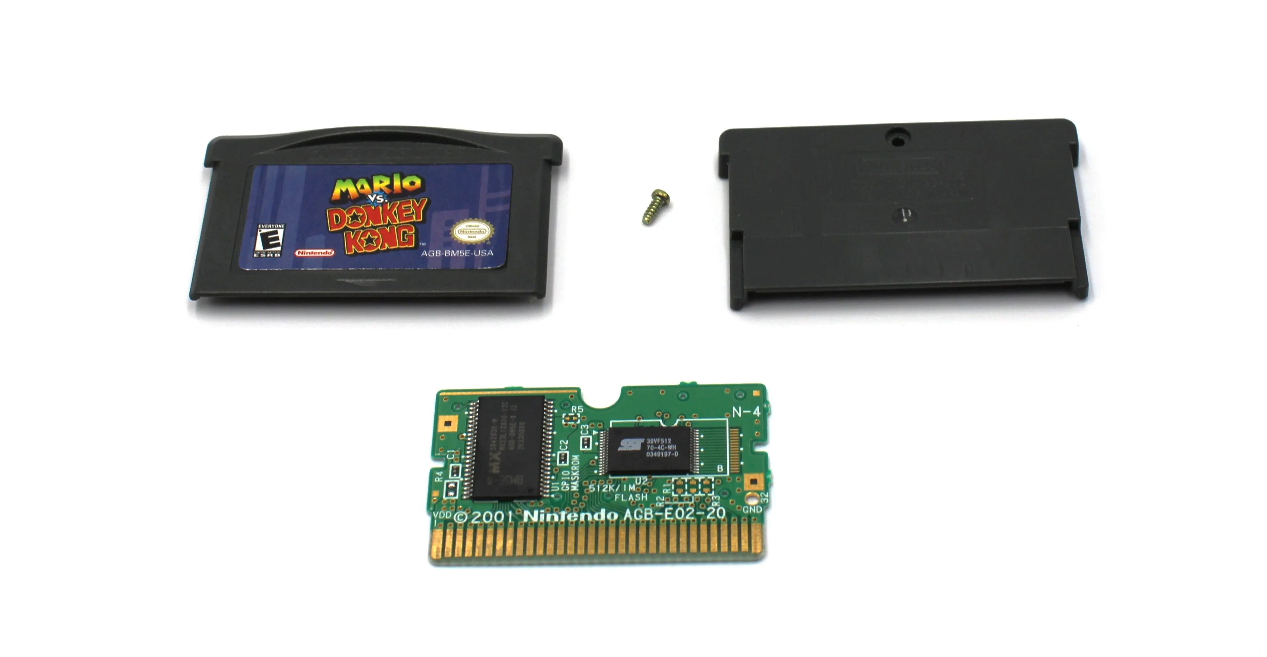 Main display of Mario vs. Donkey Kong for Nintendo Game Boy Advance GBA – Authentic Game Cartridge (2004) NTSC-U. Includes front and back shell, board, and security screw, shown fully disassembled for authenticity verification.