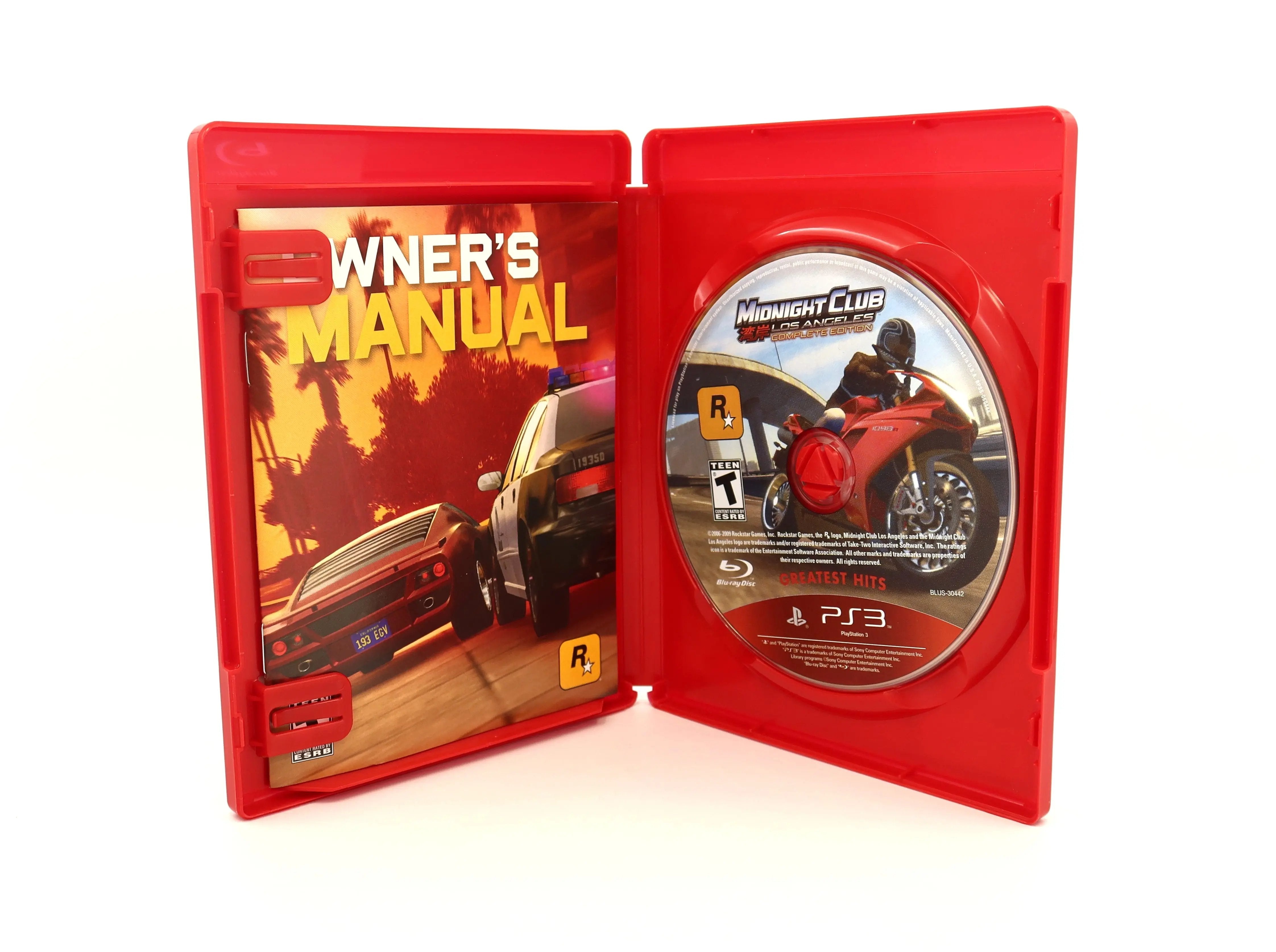 View of open case of a complete in box copy of Midnight Club Los Angeles Complete Edition for the Sony PlayStation 3. NTSC-U. Released 2009. Clear visuals of authentic matching Greatest Hits PS3 game disc with correct layout and text with the Owner's Manual Insert on a clean white background.