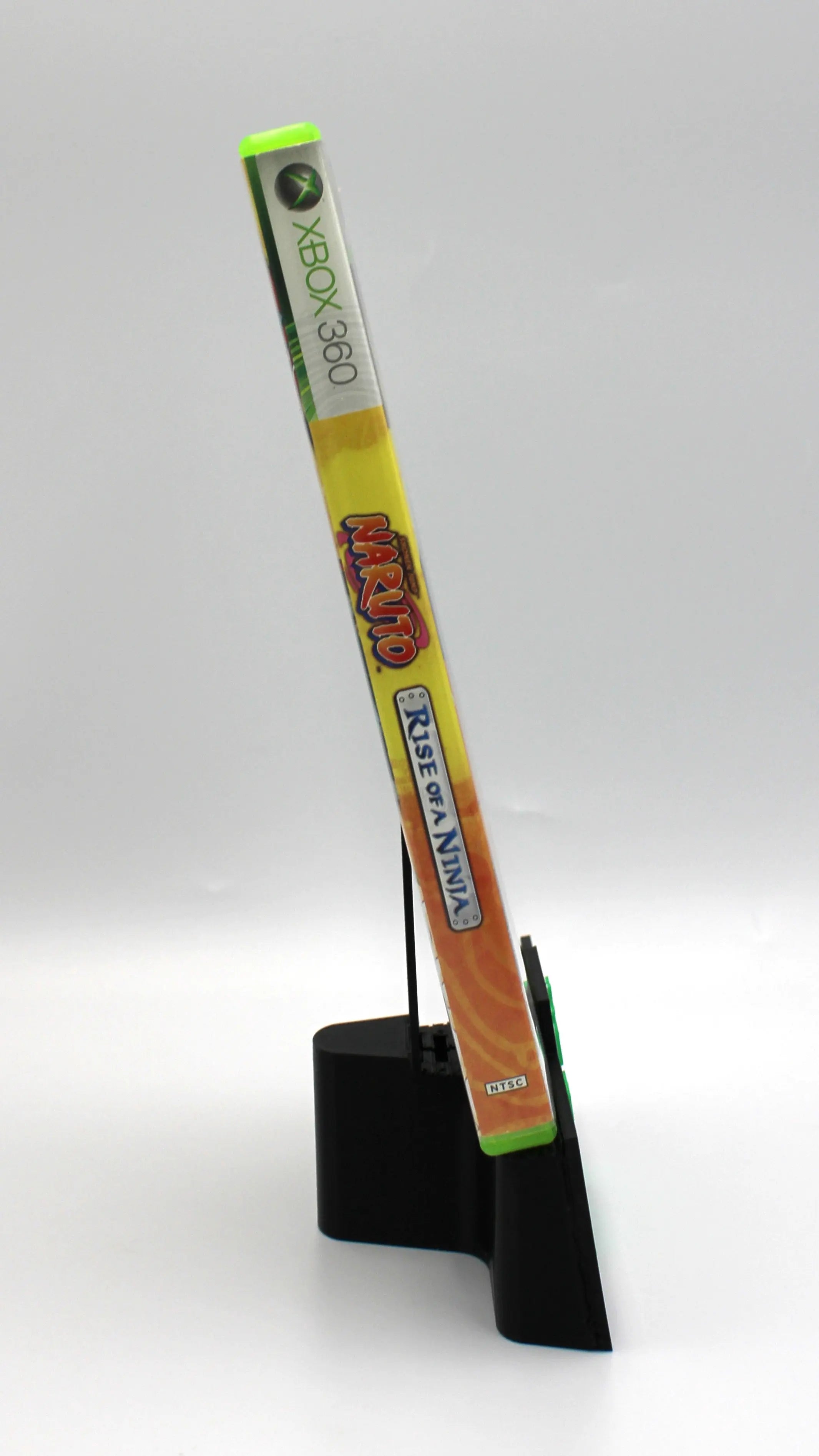 Spine view of Naruto: Rise of a Ninja for Microsoft Xbox 360 NTSC-U game case, showing title text and case alignment.