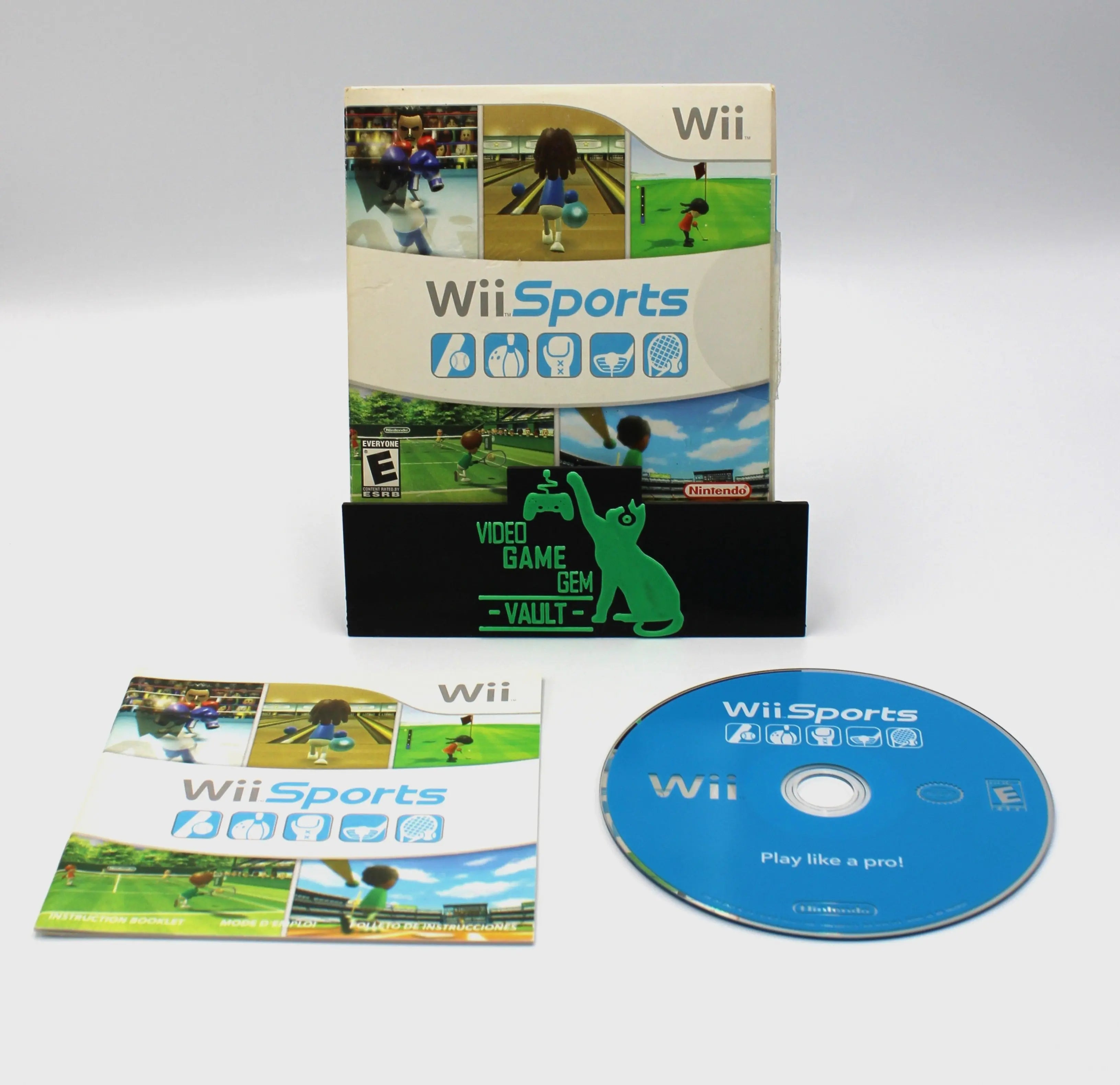 Display image of an NTSC-U copy of Wii Sports for Nintendo Wii showcasing cardboard sleeve case, instruction manual, and authentic game disc against a clean white background.