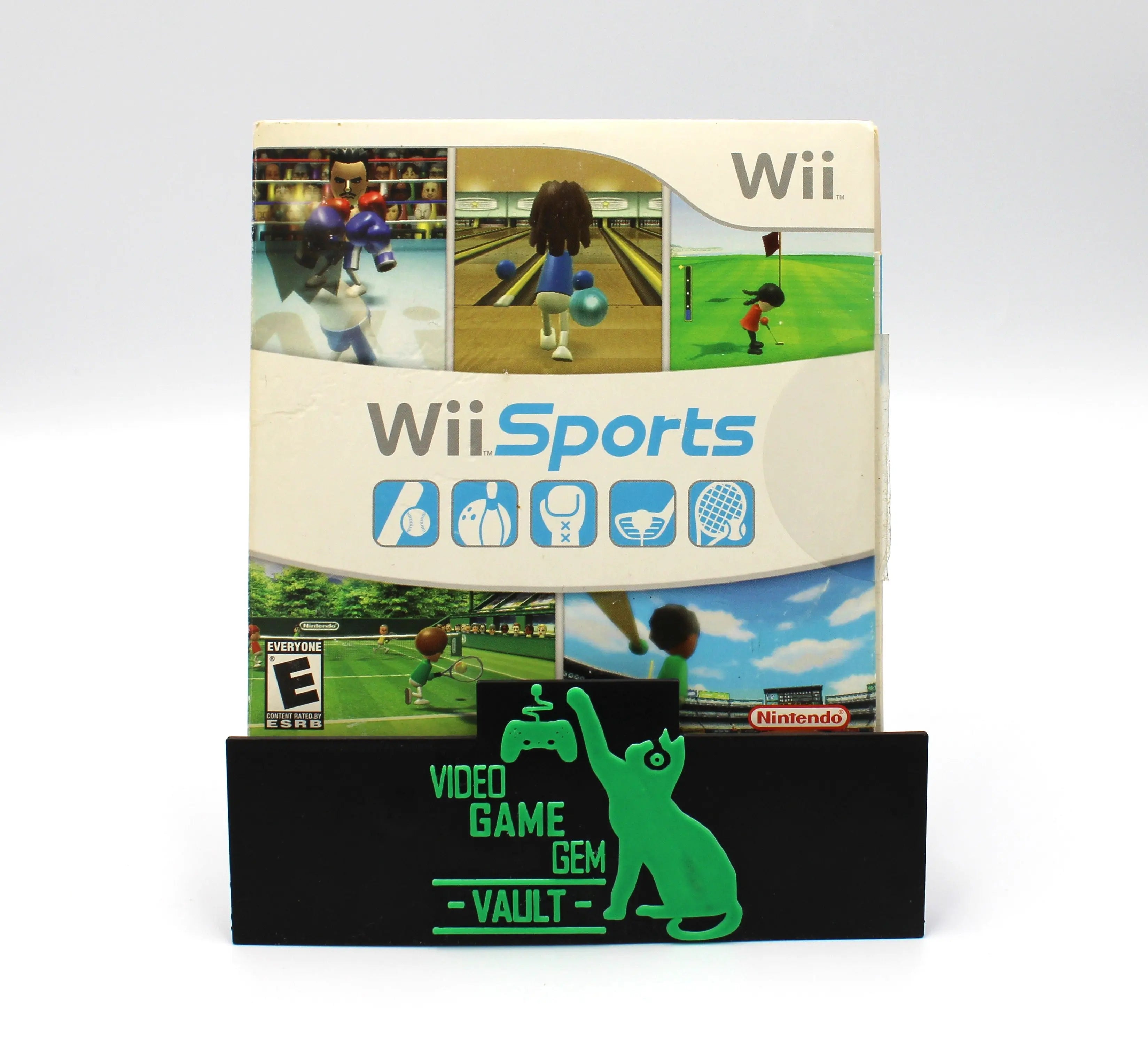 Front view of a 2006 authentic NTSC-U copy of Wii Sports for Nintendo Wii n cardboard sleeve displayed against a clean white background. Title text, E rating, Wii text, and game images are highlighted