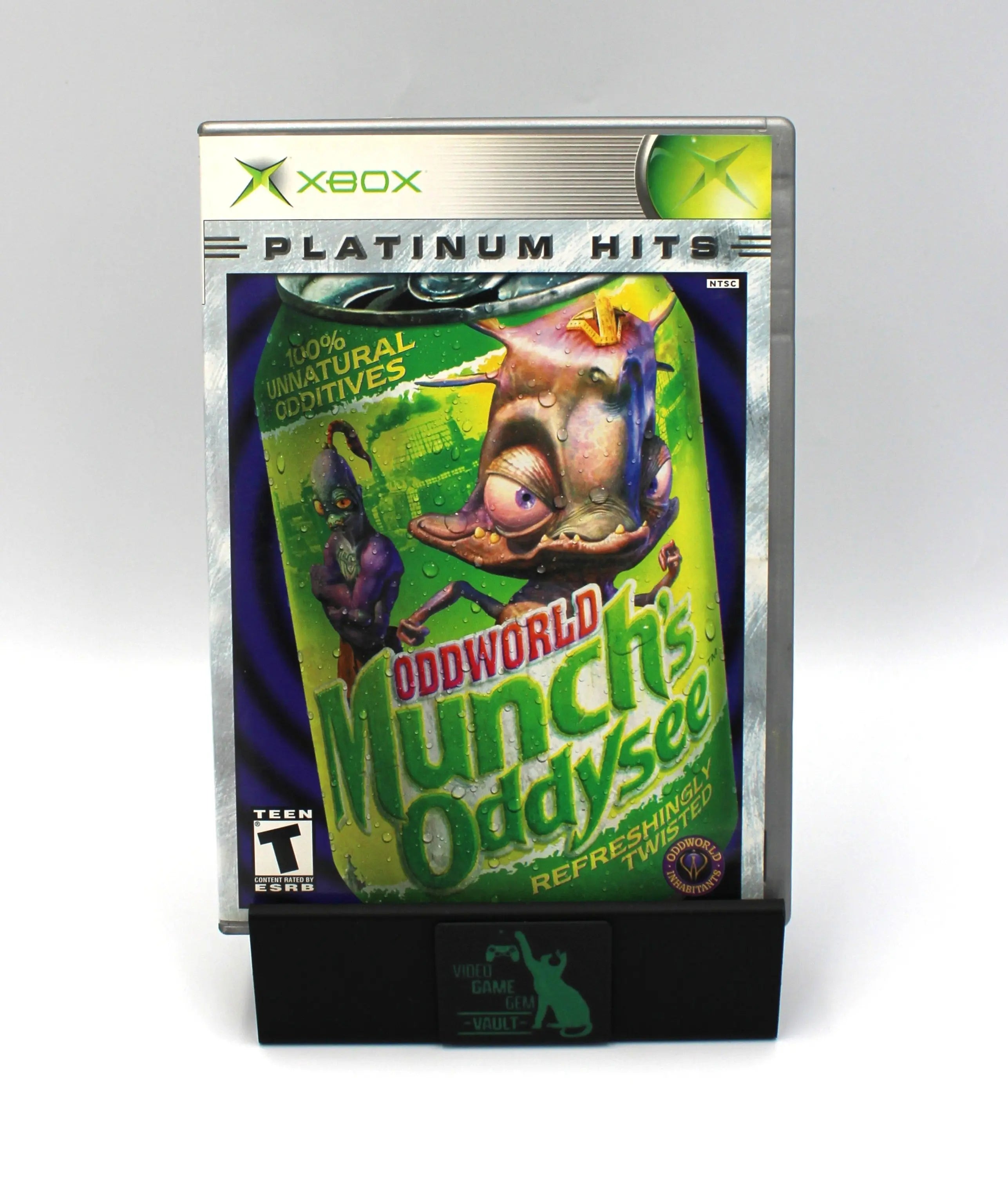 Front cover of the case for Oddworld: Munch’s Oddysee Platinum Hits for Microsoft Xbox Original – CIB with Manual (2001) NTSC‑U, featuring the game’s distinctive Platinum Hits label and artwork.