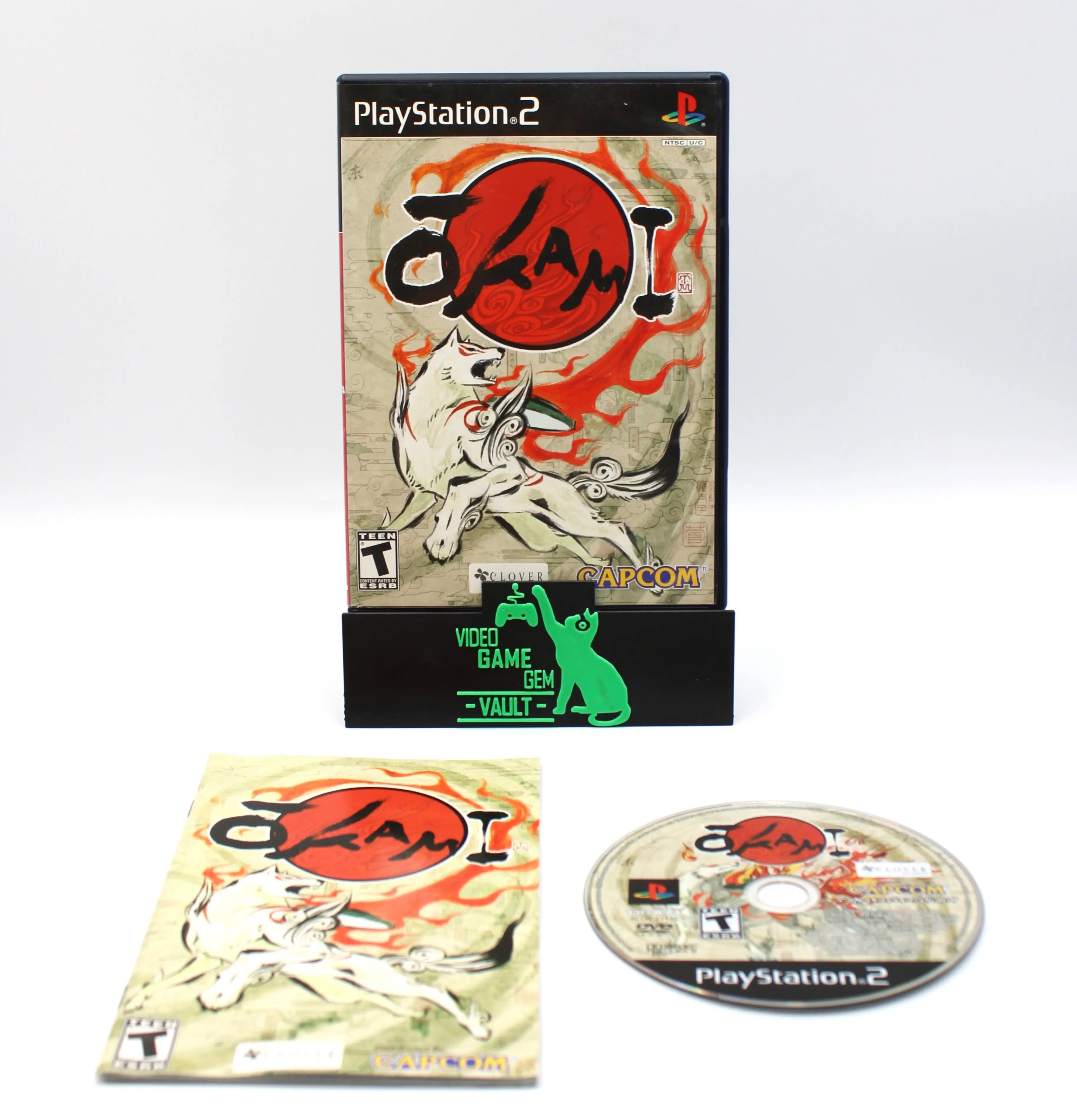 Front display of Okami PlayStation 2 black label edition, NTSC-U region, showing original case, manual, and game disc together. Refurbished and complete in box.