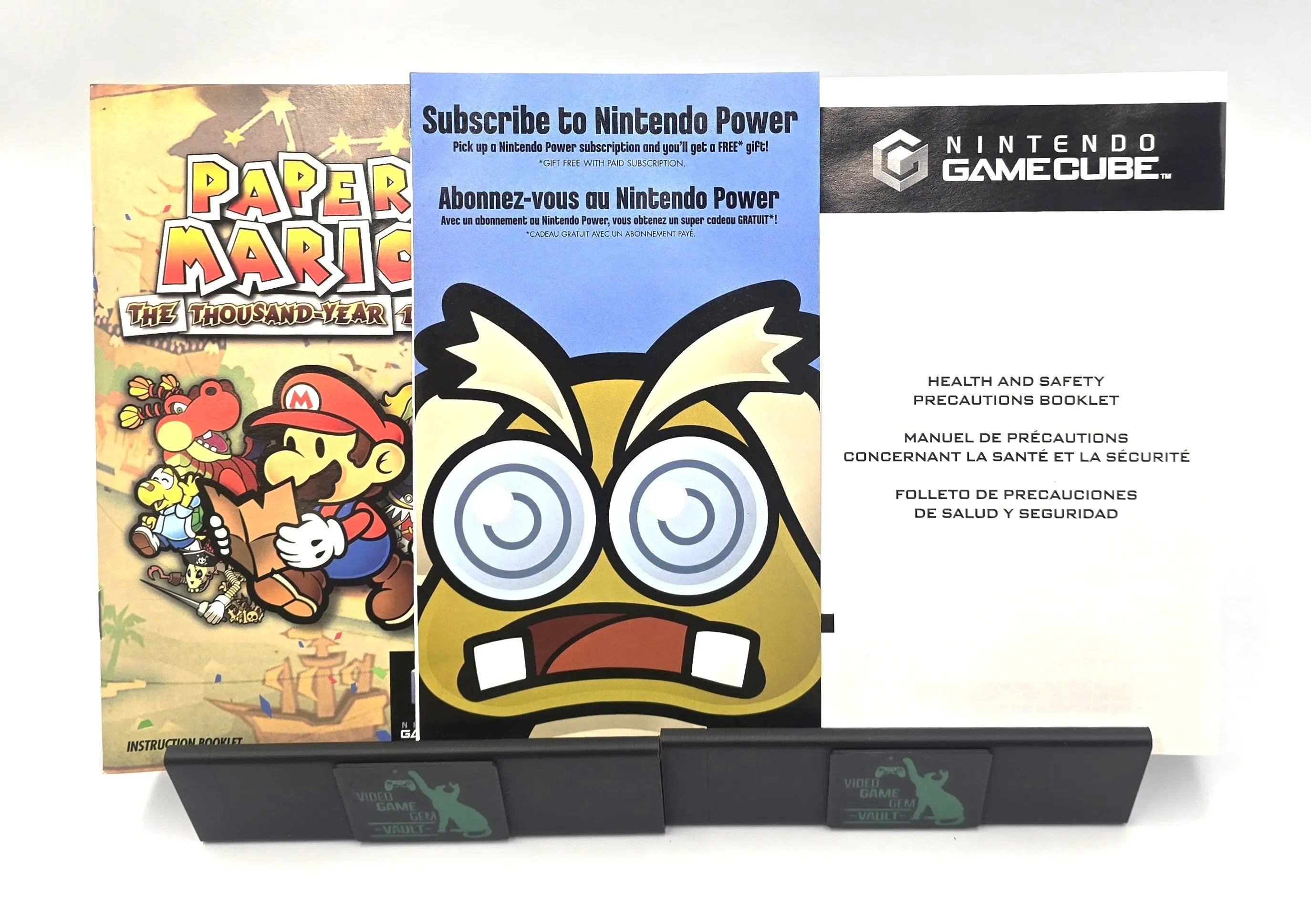 Complete inserts for Paper Mario: The Thousand-Year Door Player’s Choice Best Seller variant for Nintendo GameCube NTSC-U, including instruction booklet, Nintendo Power subscription insert, and health and safety precautions booklet.