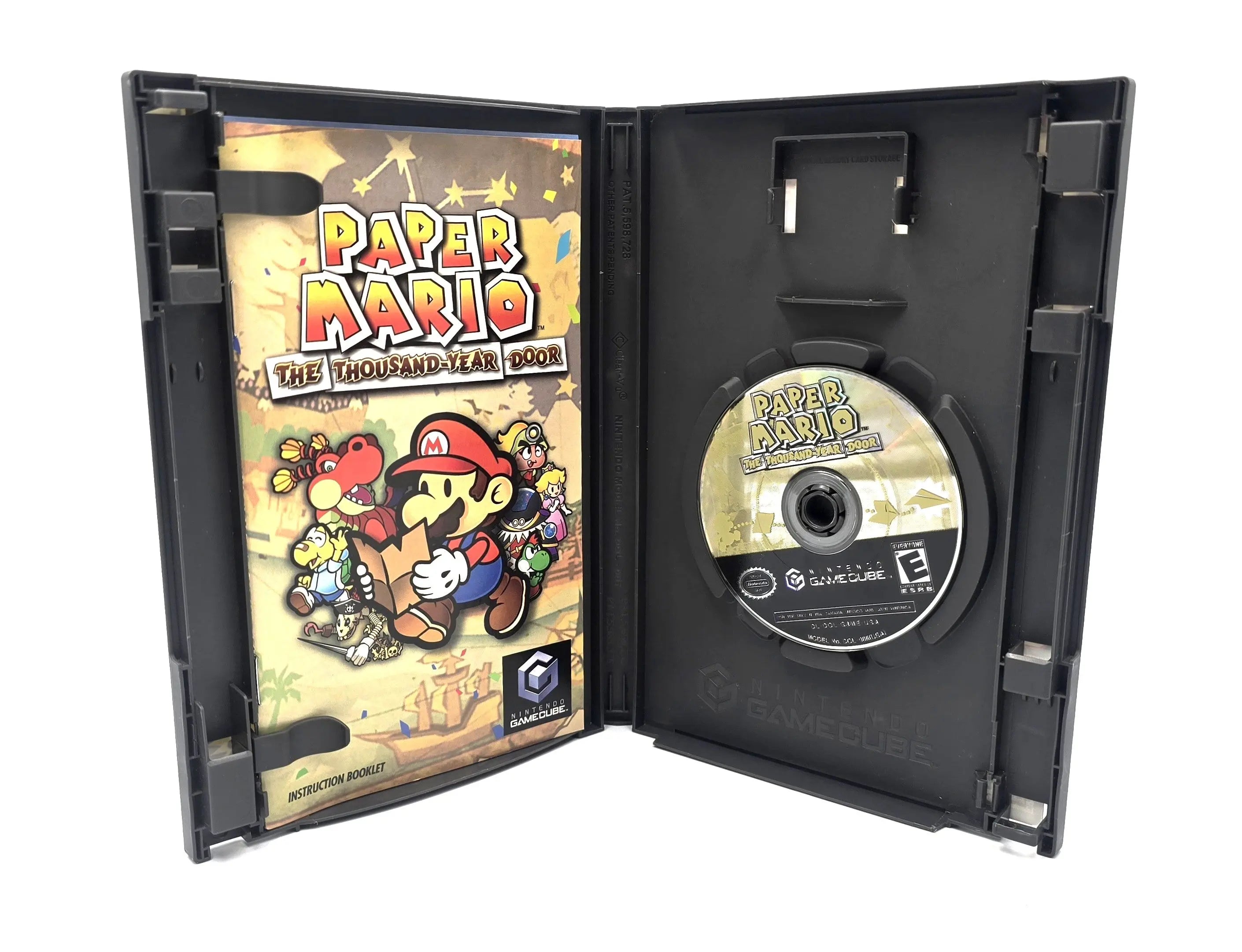 Open case view of Paper Mario: The Thousand-Year Door Player’s Choice Best Seller variant for Nintendo GameCube NTSC-U, showing instruction booklet on the left and game disc on the right.