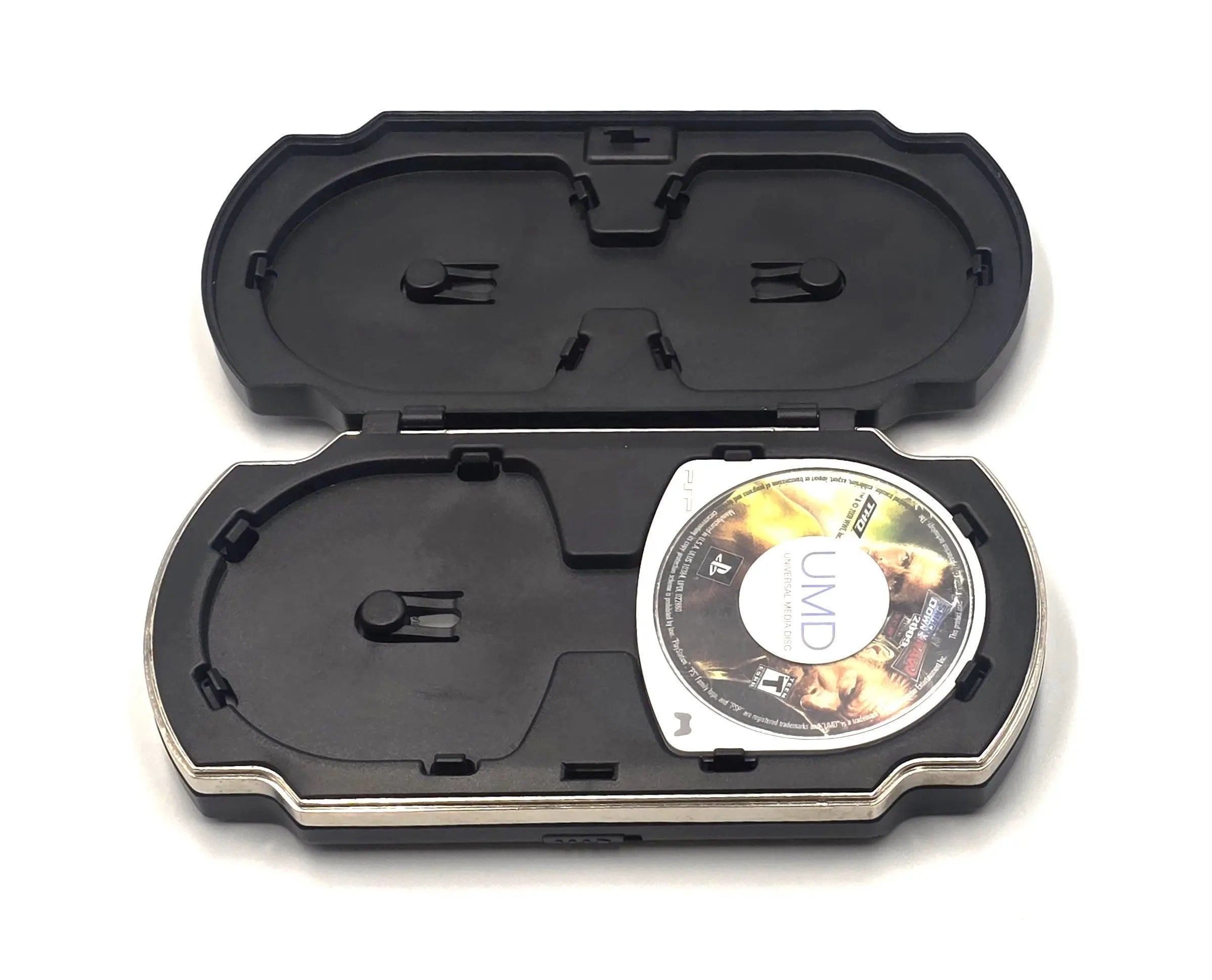 Sony PSP UMD carrying case shown open, black clamshell design with two internal disc slots.
