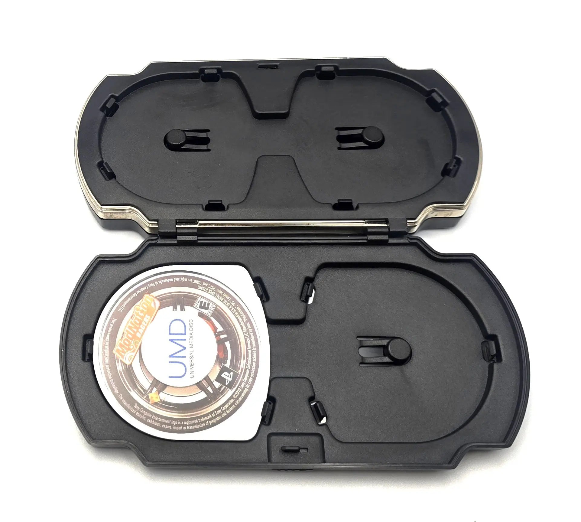 Interior view of Sony PlayStation Portable PSP UMD carrying case, designed to hold multiple UMD PSP discs.