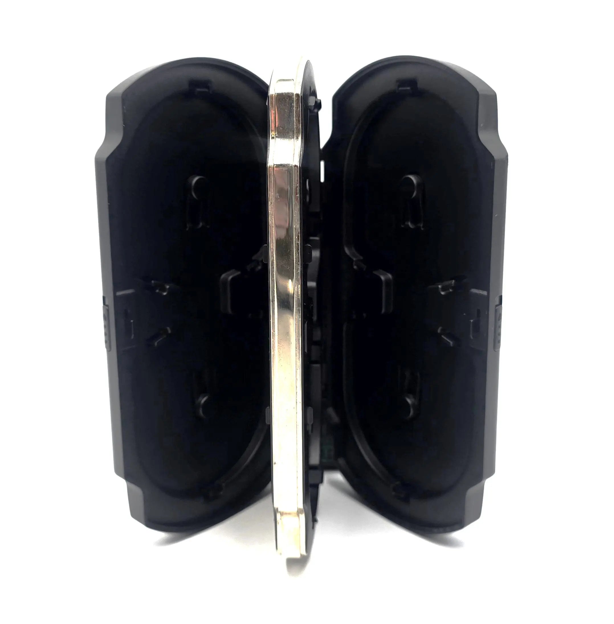 Side vertical view of Sony PSP UMD carrying case standing open, showing clamshell construction