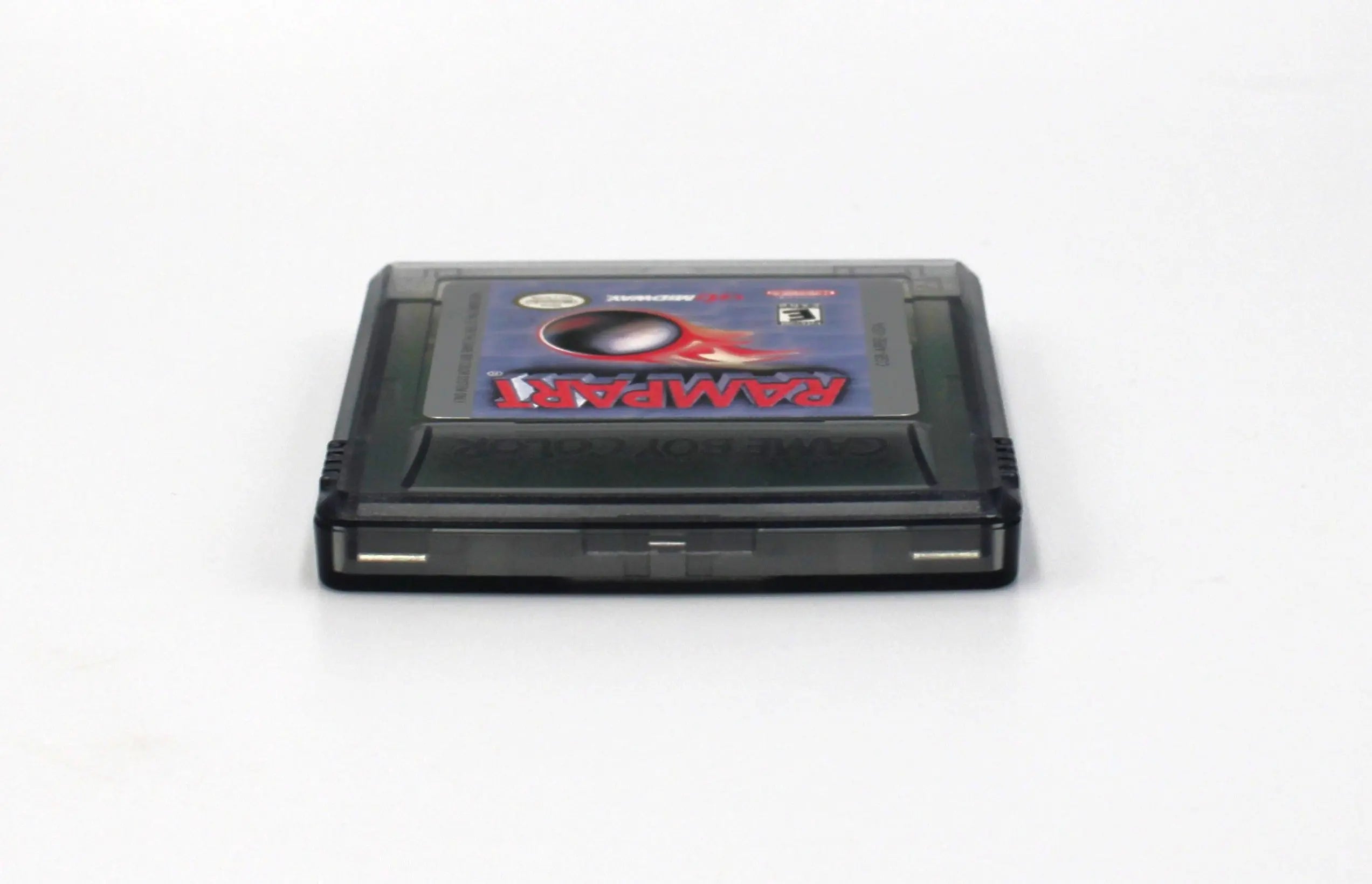 Top edge view of Rampart for Nintendo Game Boy Color GBC – Authentic Game Cartridge (1999) NTSC‑U, showing clean alignment of shell halves and label edge.