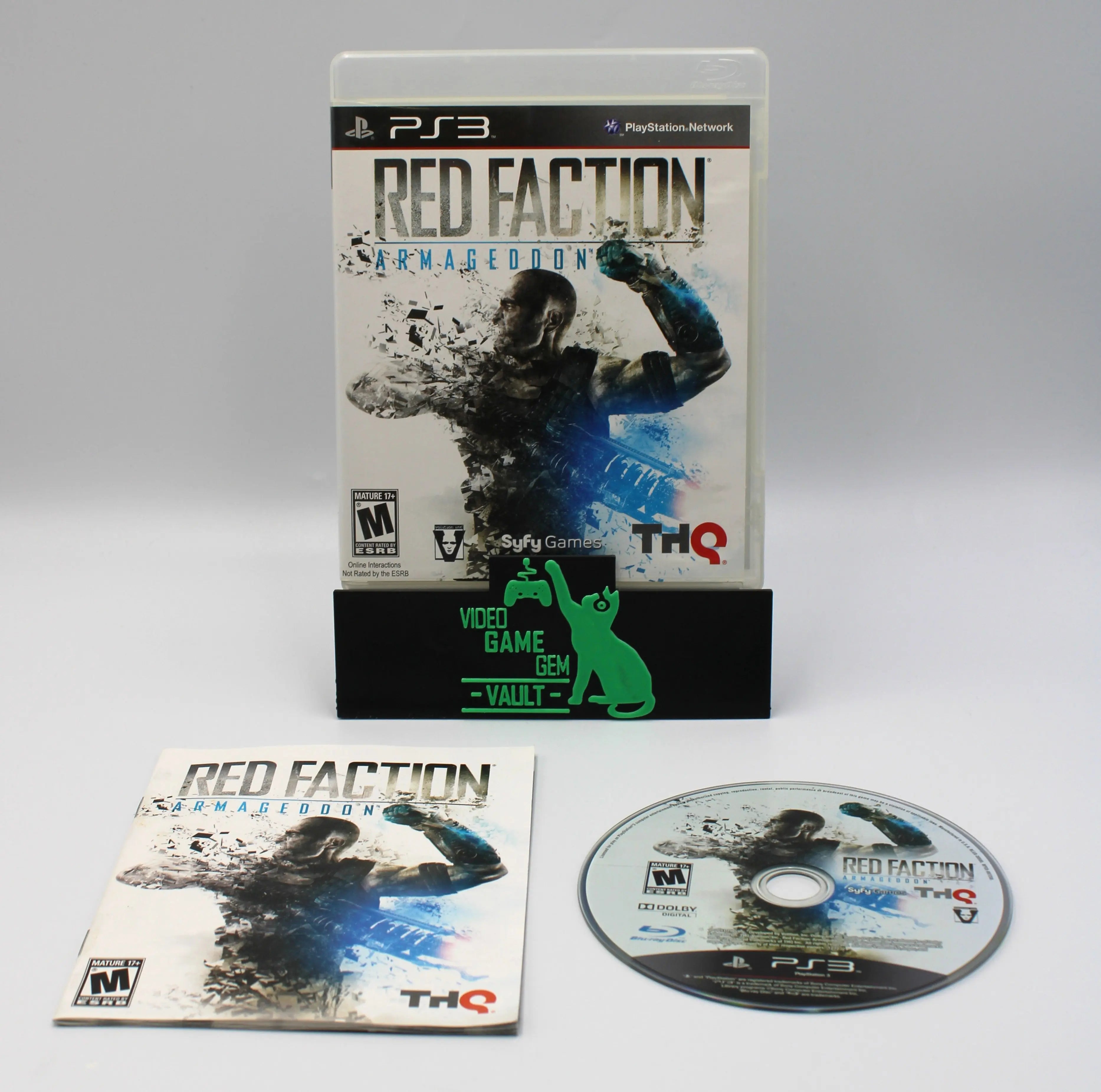 Closed case front of Red Faction: Armageddon for Sony PlayStation 3 PS3 – CIB with Manual (2011) NTSC‑U, shown alongside its original manual and game disc on a clean white background to highlight completeness.